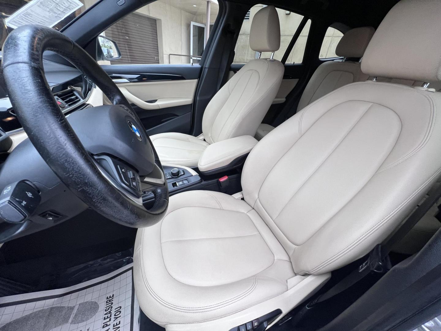 2018 White /Beige BMW X1 sDrive28i (WBXHU7C38J5) with an 2.0L L4 DOHC 16V engine, 8A transmission, located at 30 S. Berkeley Avenue, Pasadena, CA, 91107, (626) 248-7567, 34.145447, -118.109398 - Crown City Motors is a used “Buy Here Pay Here” car dealer in Pasadena CA. “Buy Here Pay Here” financing, means that when you purchase your vehicle from our dealership, that you make the payments to the dealership as well. We do not need the banks approval to get you approved for a used auto - Photo#20