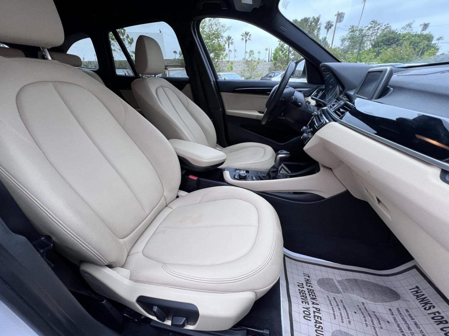 2018 White /Beige BMW X1 sDrive28i (WBXHU7C38J5) with an 2.0L L4 DOHC 16V engine, 8A transmission, located at 30 S. Berkeley Avenue, Pasadena, CA, 91107, (626) 248-7567, 34.145447, -118.109398 - Crown City Motors is a used “Buy Here Pay Here” car dealer in Pasadena CA. “Buy Here Pay Here” financing, means that when you purchase your vehicle from our dealership, that you make the payments to the dealership as well. We do not need the banks approval to get you approved for a used auto - Photo#25