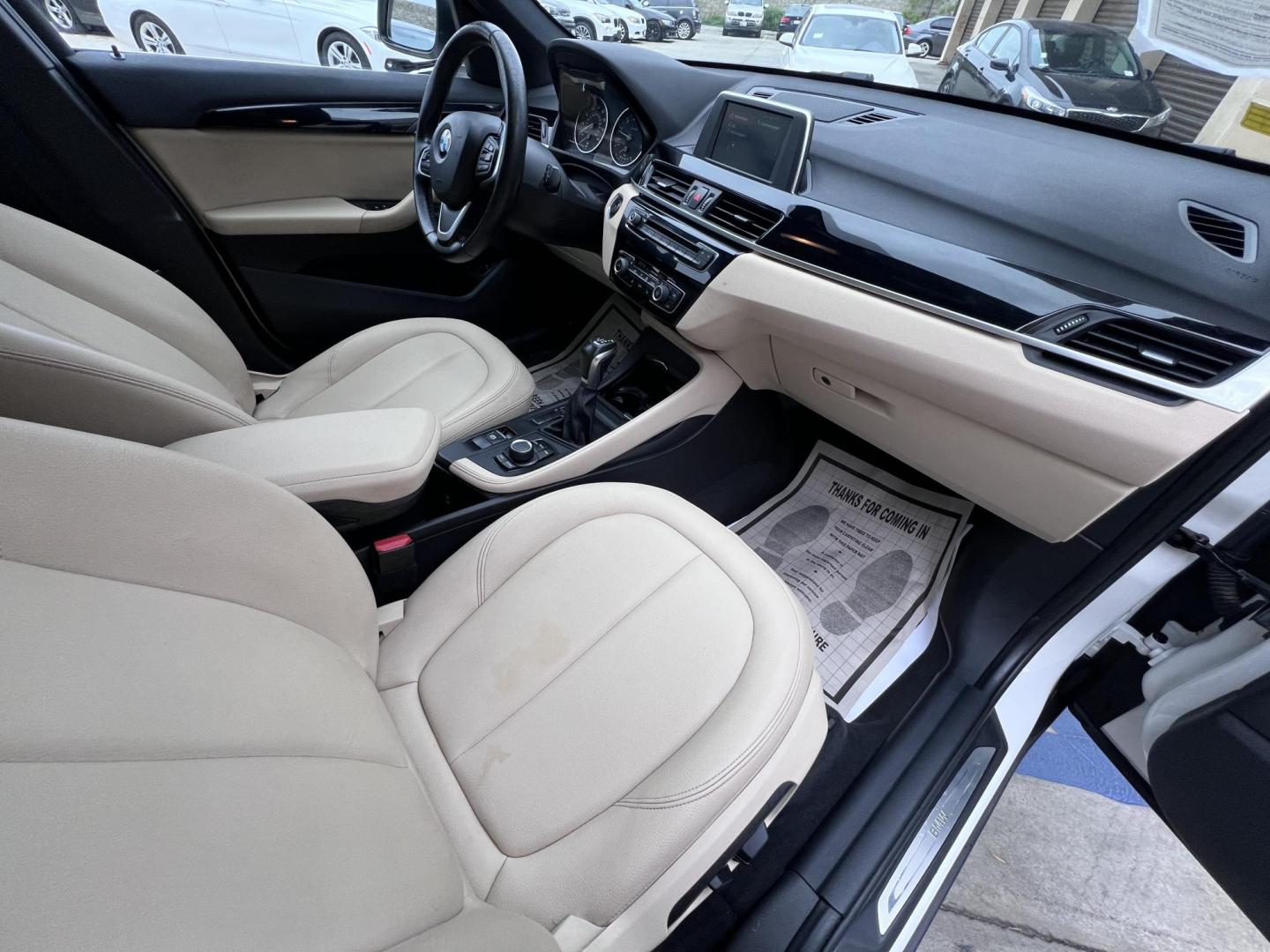 2018 White /Beige BMW X1 sDrive28i (WBXHU7C38J5) with an 2.0L L4 DOHC 16V engine, 8A transmission, located at 30 S. Berkeley Avenue, Pasadena, CA, 91107, (626) 248-7567, 34.145447, -118.109398 - Crown City Motors is a used “Buy Here Pay Here” car dealer in Pasadena CA. “Buy Here Pay Here” financing, means that when you purchase your vehicle from our dealership, that you make the payments to the dealership as well. We do not need the banks approval to get you approved for a used auto - Photo#26