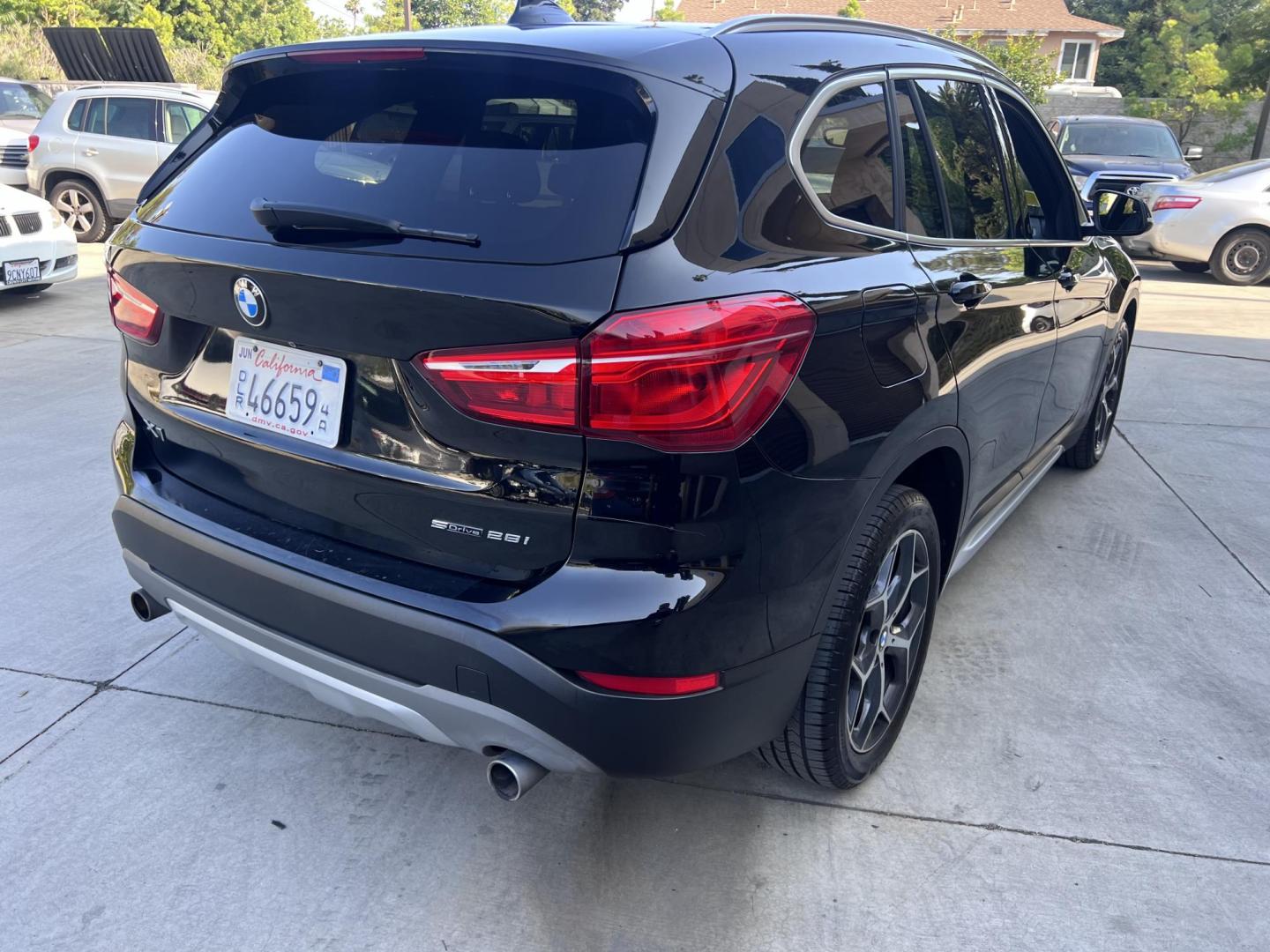 2018 BLACK /Black BMW X1 sDrive28i (WBXHU7C34J5) with an 2.0L L4 DOHC 16V engine, 8A transmission, located at 30 S. Berkeley Avenue, Pasadena, CA, 91107, (626) 248-7567, 34.145447, -118.109398 - 018 BMW X1 sDrive28i – Luxury, Performance and Affordability | Buy Here Pay Here – Pasadena, CA Step into luxury, style, and versatility with this 2018 BMW X1 sDrive28i, available now at Crown City Motors, Pasadena’s trusted Buy Here Pay Here (BHPH) dealership. Whether you're dealing with b - Photo#4