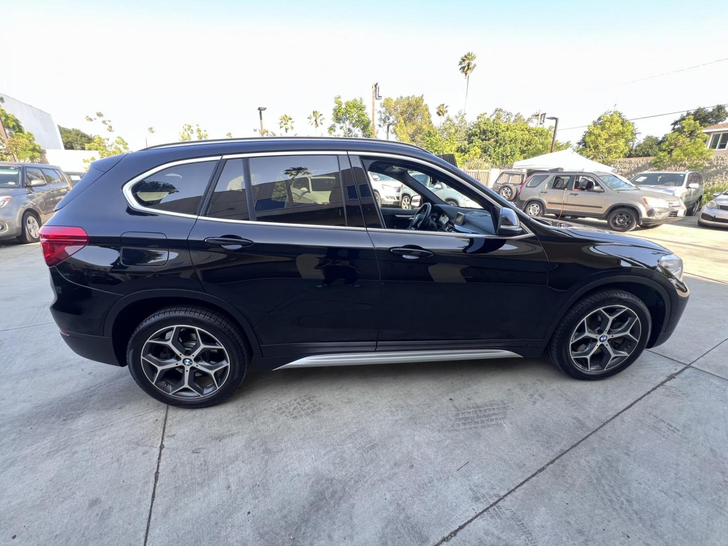 2018 BLACK /Black BMW X1 sDrive28i (WBXHU7C34J5) with an 2.0L L4 DOHC 16V engine, 8A transmission, located at 30 S. Berkeley Avenue, Pasadena, CA, 91107, (626) 248-7567, 34.145447, -118.109398 - 018 BMW X1 sDrive28i – Luxury, Performance and Affordability | Buy Here Pay Here – Pasadena, CA Step into luxury, style, and versatility with this 2018 BMW X1 sDrive28i, available now at Crown City Motors, Pasadena’s trusted Buy Here Pay Here (BHPH) dealership. Whether you're dealing with b - Photo#5