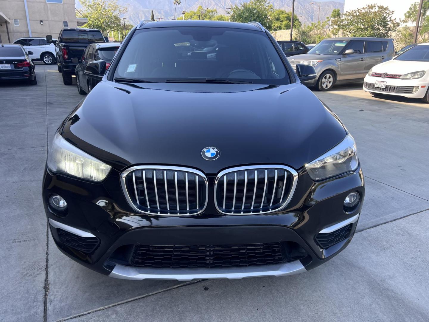 2018 BLACK /Black BMW X1 sDrive28i (WBXHU7C34J5) with an 2.0L L4 DOHC 16V engine, 8A transmission, located at 30 S. Berkeley Avenue, Pasadena, CA, 91107, (626) 248-7567, 34.145447, -118.109398 - 018 BMW X1 sDrive28i – Luxury, Performance and Affordability | Buy Here Pay Here – Pasadena, CA Step into luxury, style, and versatility with this 2018 BMW X1 sDrive28i, available now at Crown City Motors, Pasadena’s trusted Buy Here Pay Here (BHPH) dealership. Whether you're dealing with b - Photo#8