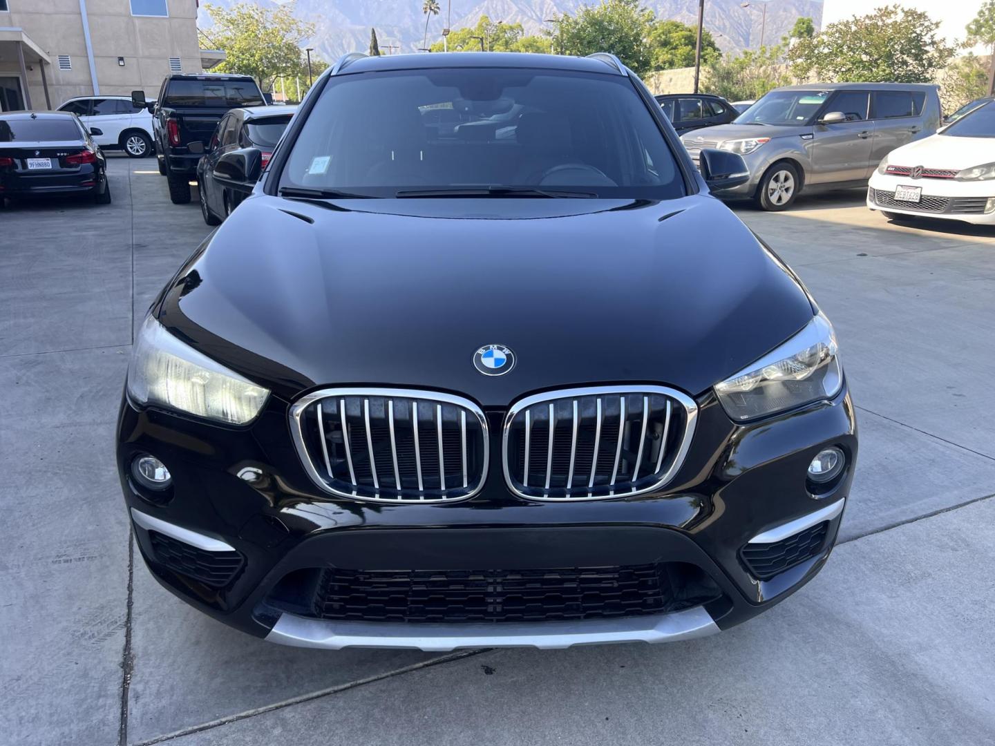 2018 BLACK /Black BMW X1 sDrive28i (WBXHU7C34J5) with an 2.0L L4 DOHC 16V engine, 8A transmission, located at 30 S. Berkeley Avenue, Pasadena, CA, 91107, (626) 248-7567, 34.145447, -118.109398 - 018 BMW X1 sDrive28i – Luxury, Performance and Affordability | Buy Here Pay Here – Pasadena, CA Step into luxury, style, and versatility with this 2018 BMW X1 sDrive28i, available now at Crown City Motors, Pasadena’s trusted Buy Here Pay Here (BHPH) dealership. Whether you're dealing with b - Photo#9