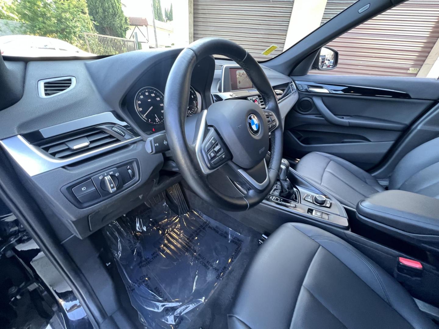 2018 BLACK /Black BMW X1 sDrive28i (WBXHU7C34J5) with an 2.0L L4 DOHC 16V engine, 8A transmission, located at 30 S. Berkeley Avenue, Pasadena, CA, 91107, (626) 248-7567, 34.145447, -118.109398 - 018 BMW X1 sDrive28i – Luxury, Performance and Affordability | Buy Here Pay Here – Pasadena, CA Step into luxury, style, and versatility with this 2018 BMW X1 sDrive28i, available now at Crown City Motors, Pasadena’s trusted Buy Here Pay Here (BHPH) dealership. Whether you're dealing with b - Photo#14
