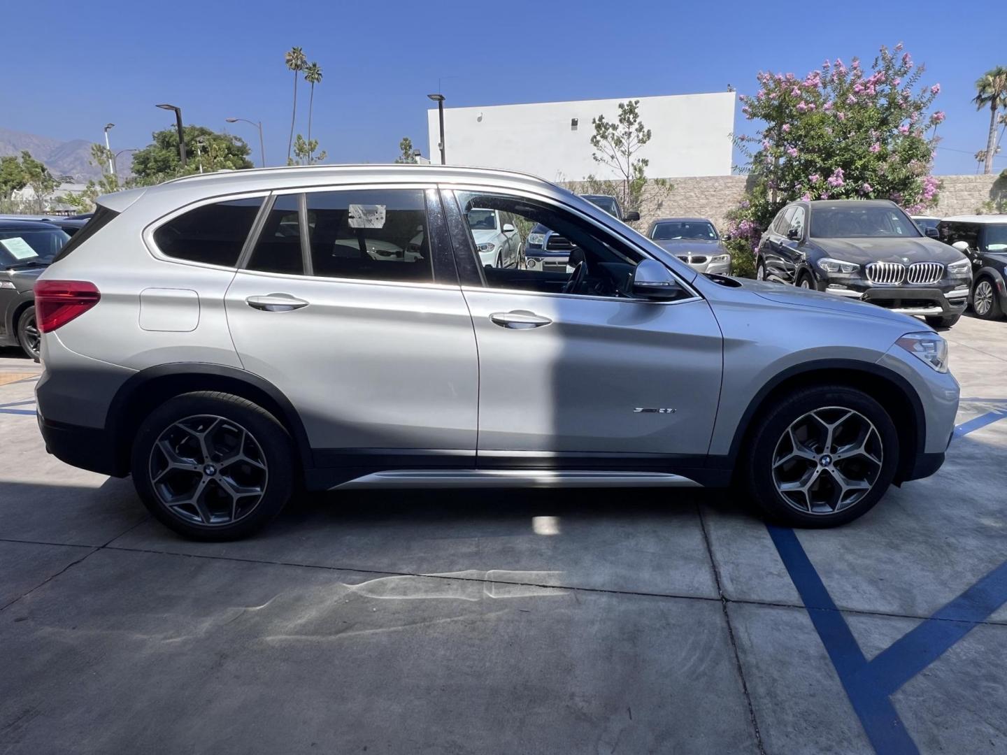 2018 Silver Metallic /Black BMW X1 sDrive28i (WBXHU7C34J5) with an 2.0L L4 DOHC 16V engine, 8A transmission, located at 30 S. Berkeley Avenue, Pasadena, CA, 91107, (626) 248-7567, 34.145447, -118.109398 - 2018 BMW X1 xDrive28i – Luxury, Performance, and Affordability in One SUV VIN: WBXHU7C34J5H42594 Location: Crown City Motors, Pasadena, CA Status: Available Now – Clean Title – Financing Options for All Credit Types Looking for a luxury crossover SUV that combines sporty performance, ele - Photo#5