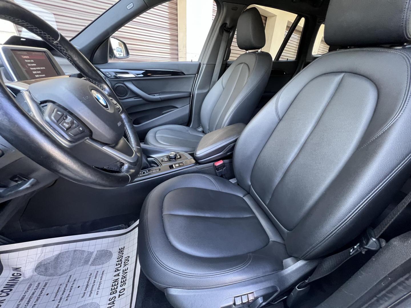 2018 Silver Metallic /Black BMW X1 sDrive28i (WBXHU7C34J5) with an 2.0L L4 DOHC 16V engine, 8A transmission, located at 30 S. Berkeley Avenue, Pasadena, CA, 91107, (626) 248-7567, 34.145447, -118.109398 - 2018 BMW X1 xDrive28i – Luxury, Performance, and Affordability in One SUV VIN: WBXHU7C34J5H42594 Location: Crown City Motors, Pasadena, CA Status: Available Now – Clean Title – Financing Options for All Credit Types Looking for a luxury crossover SUV that combines sporty performance, ele - Photo#20