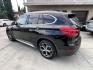 2018 Black BMW X1 xDrive28i (WBXHT3C33J5) with an 2.0L L4 DOHC 16V engine, 8A transmission, located at 30 S. Berkeley Avenue, Pasadena, CA, 91107, (626) 248-7567, 34.145447, -118.109398 - Crown City Motors is a used “Buy Here Pay Here” car dealer in Pasadena CA. “Buy Here Pay Here” financing, means that when you purchase your vehicle from our dealership, that you make the payments to the dealership as well. We do not need the banks approval to get you approved for a used auto - Photo#2