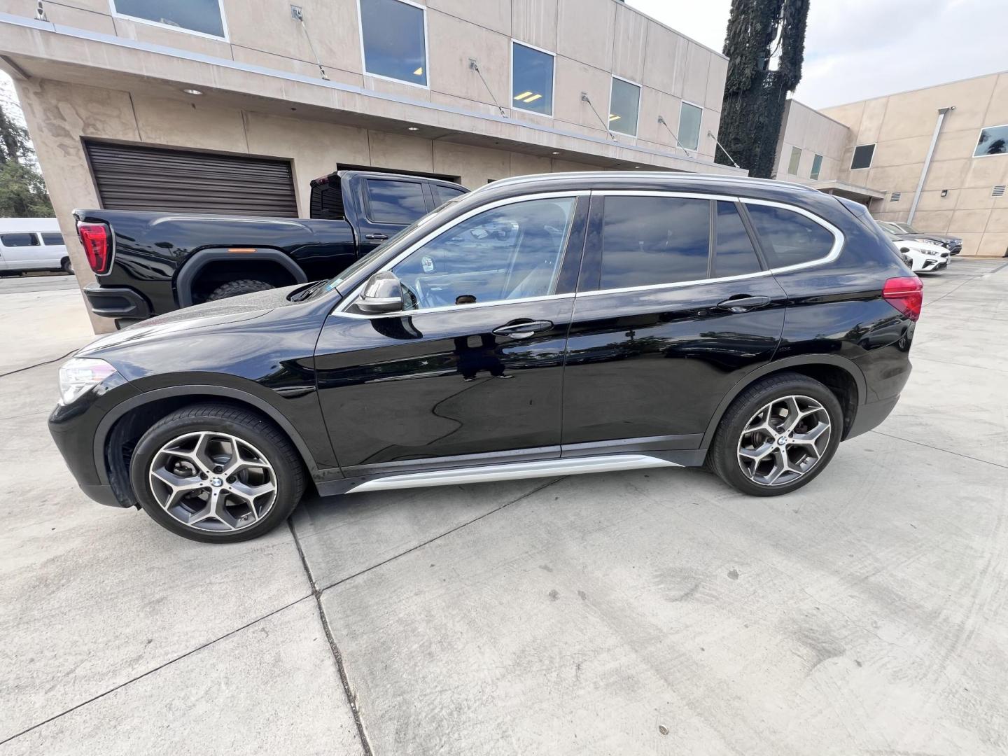 2018 Black BMW X1 xDrive28i (WBXHT3C33J5) with an 2.0L L4 DOHC 16V engine, 8A transmission, located at 30 S. Berkeley Avenue, Pasadena, CA, 91107, (626) 248-7567, 34.145447, -118.109398 - Crown City Motors is a used “Buy Here Pay Here” car dealer in Pasadena CA. “Buy Here Pay Here” financing, means that when you purchase your vehicle from our dealership, that you make the payments to the dealership as well. We do not need the banks approval to get you approved for a used auto - Photo#3