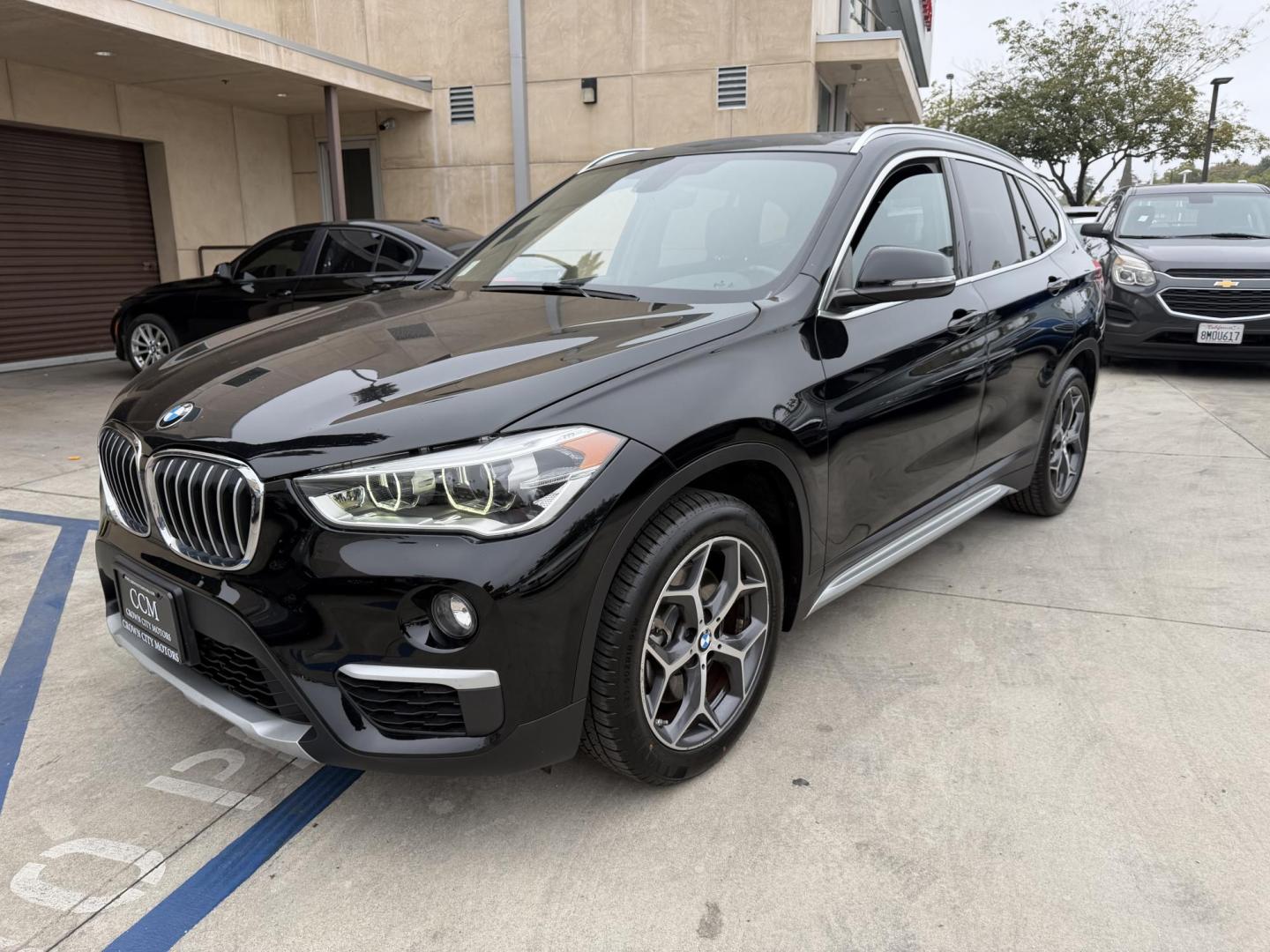 2018 Black BMW X1 xDrive28i (WBXHT3C33J5) with an 2.0L L4 DOHC 16V engine, 8A transmission, located at 30 S. Berkeley Avenue, Pasadena, CA, 91107, (626) 248-7567, 34.145447, -118.109398 - Crown City Motors is a used “Buy Here Pay Here” car dealer in Pasadena CA. “Buy Here Pay Here” financing, means that when you purchase your vehicle from our dealership, that you make the payments to the dealership as well. We do not need the banks approval to get you approved for a used auto - Photo#5