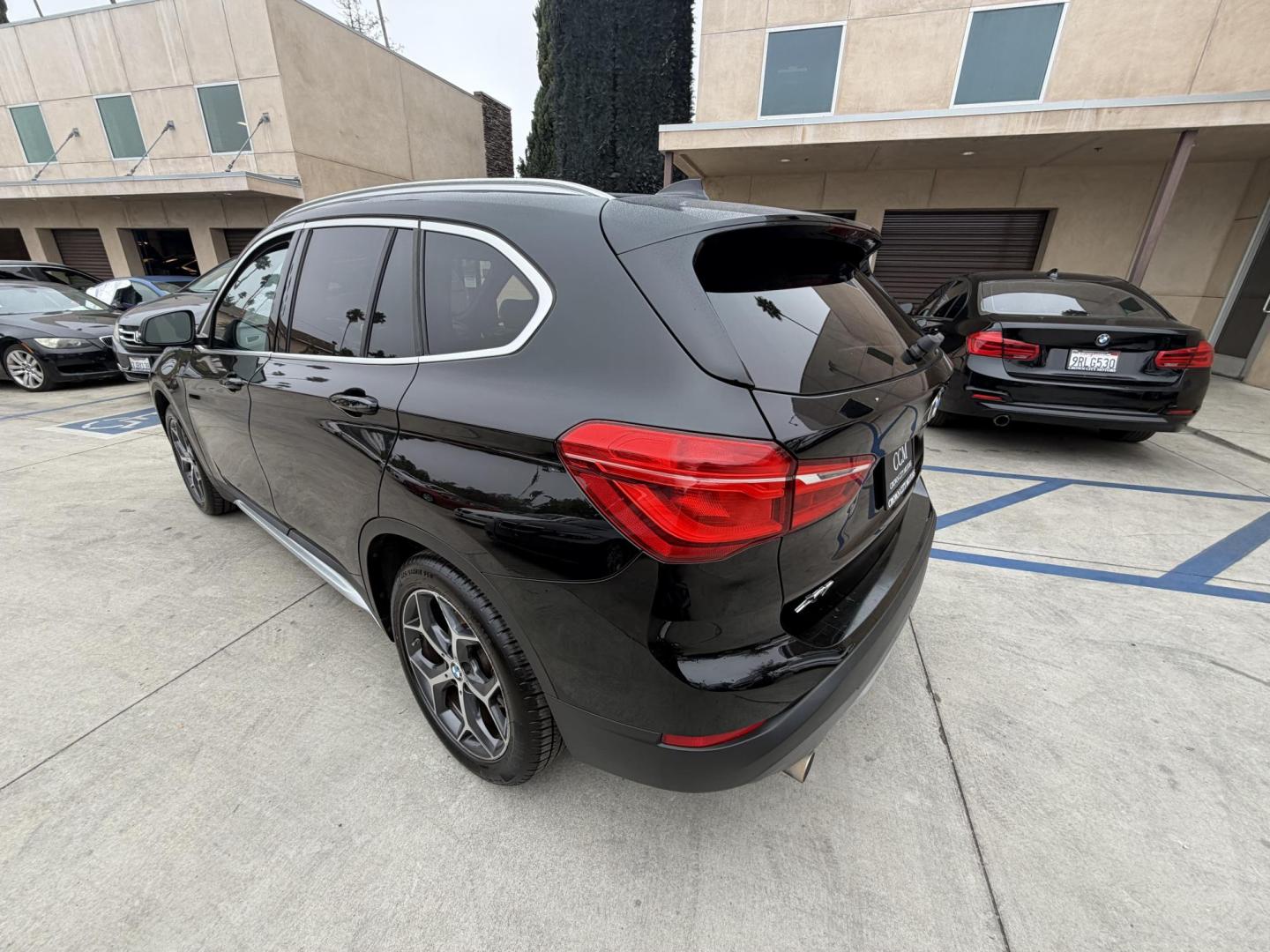 2018 Black BMW X1 xDrive28i (WBXHT3C33J5) with an 2.0L L4 DOHC 16V engine, 8A transmission, located at 30 S. Berkeley Avenue, Pasadena, CA, 91107, (626) 248-7567, 34.145447, -118.109398 - Crown City Motors is a used “Buy Here Pay Here” car dealer in Pasadena CA. “Buy Here Pay Here” financing, means that when you purchase your vehicle from our dealership, that you make the payments to the dealership as well. We do not need the banks approval to get you approved for a used auto - Photo#7