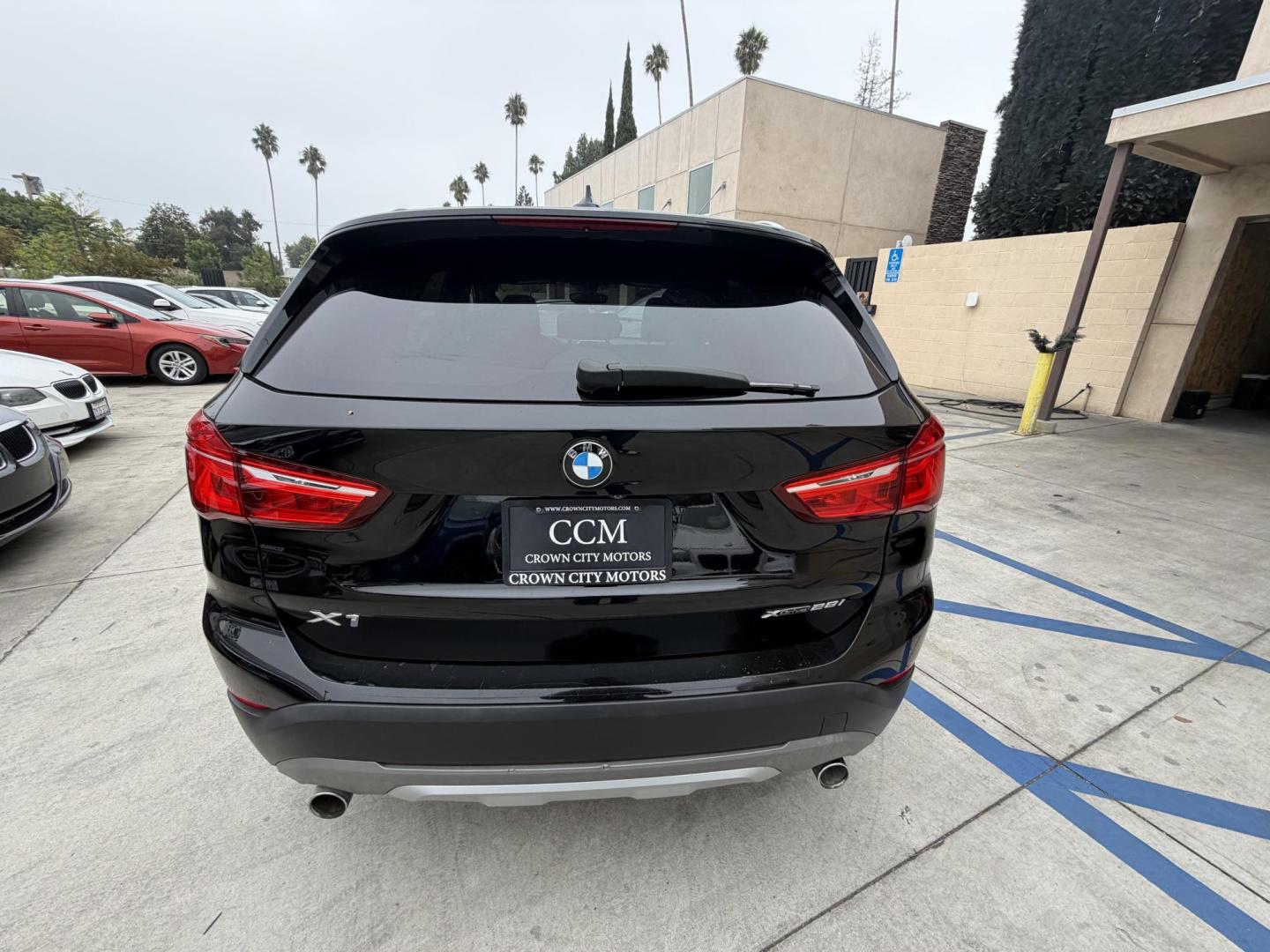 2018 Black BMW X1 xDrive28i (WBXHT3C33J5) with an 2.0L L4 DOHC 16V engine, 8A transmission, located at 30 S. Berkeley Avenue, Pasadena, CA, 91107, (626) 248-7567, 34.145447, -118.109398 - Crown City Motors is a used “Buy Here Pay Here” car dealer in Pasadena CA. “Buy Here Pay Here” financing, means that when you purchase your vehicle from our dealership, that you make the payments to the dealership as well. We do not need the banks approval to get you approved for a used auto - Photo#6