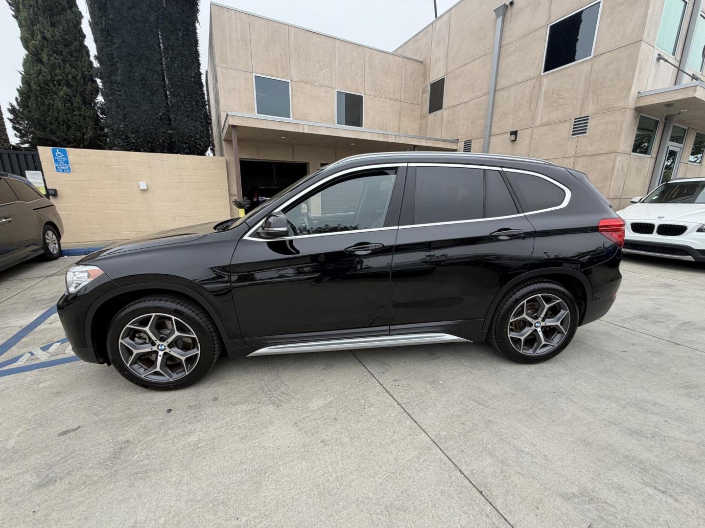 2018 Black BMW X1 xDrive28i (WBXHT3C33J5) with an 2.0L L4 DOHC 16V engine, 8A transmission, located at 30 S. Berkeley Avenue, Pasadena, CA, 91107, (626) 248-7567, 34.145447, -118.109398 - Crown City Motors is a used “Buy Here Pay Here” car dealer in Pasadena CA. “Buy Here Pay Here” financing, means that when you purchase your vehicle from our dealership, that you make the payments to the dealership as well. We do not need the banks approval to get you approved for a used auto - Photo#8
