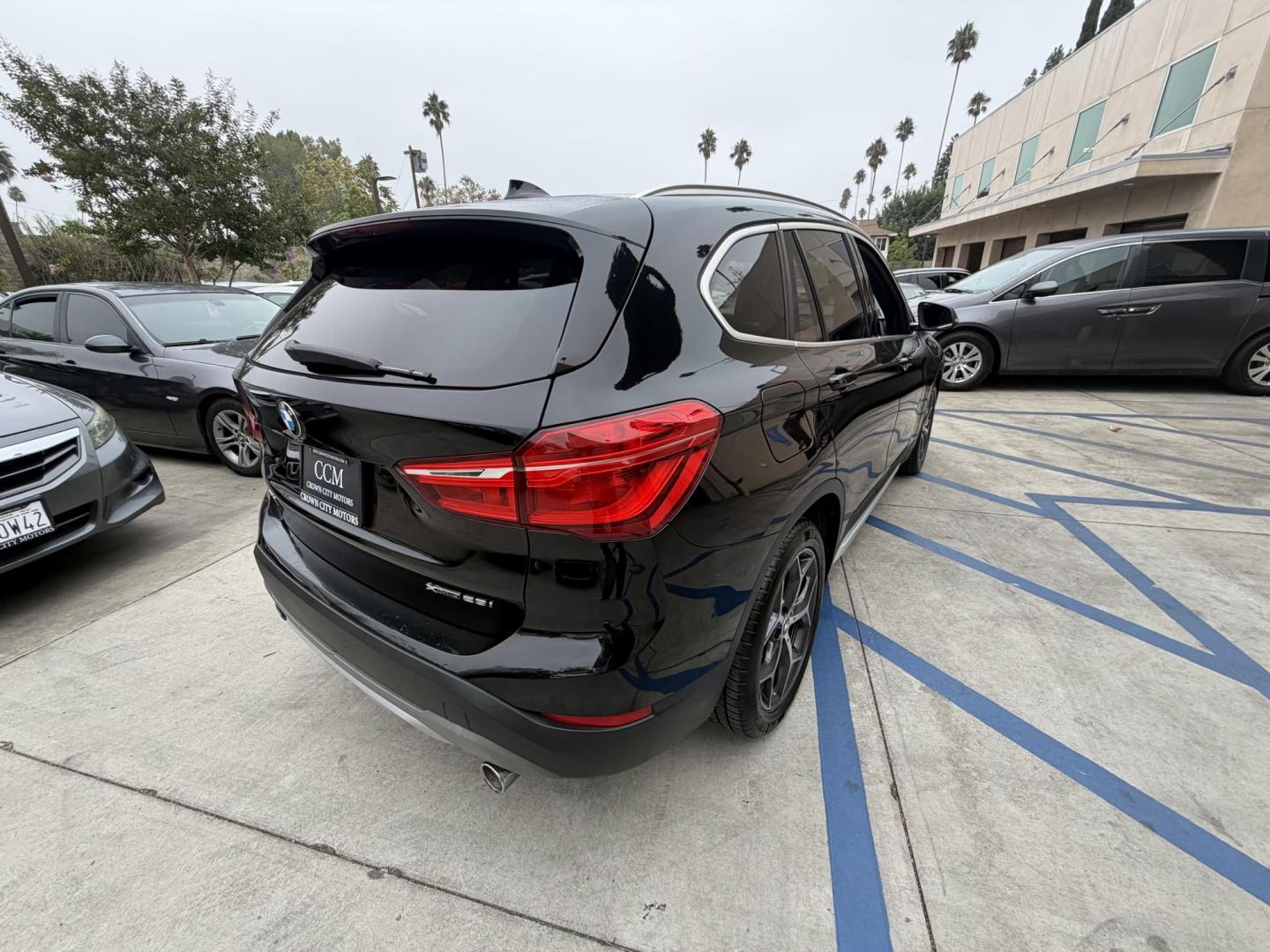 2018 Black BMW X1 xDrive28i (WBXHT3C33J5) with an 2.0L L4 DOHC 16V engine, 8A transmission, located at 30 S. Berkeley Avenue, Pasadena, CA, 91107, (626) 248-7567, 34.145447, -118.109398 - Crown City Motors is a used “Buy Here Pay Here” car dealer in Pasadena CA. “Buy Here Pay Here” financing, means that when you purchase your vehicle from our dealership, that you make the payments to the dealership as well. We do not need the banks approval to get you approved for a used auto - Photo#9