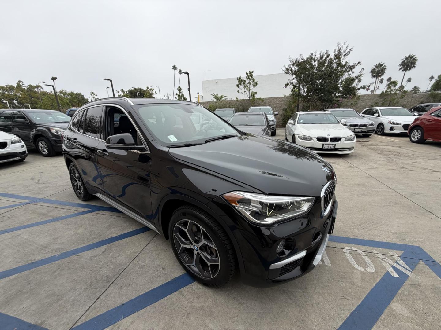 2018 Black BMW X1 xDrive28i (WBXHT3C33J5) with an 2.0L L4 DOHC 16V engine, 8A transmission, located at 30 S. Berkeley Avenue, Pasadena, CA, 91107, (626) 248-7567, 34.145447, -118.109398 - Crown City Motors is a used “Buy Here Pay Here” car dealer in Pasadena CA. “Buy Here Pay Here” financing, means that when you purchase your vehicle from our dealership, that you make the payments to the dealership as well. We do not need the banks approval to get you approved for a used auto - Photo#11
