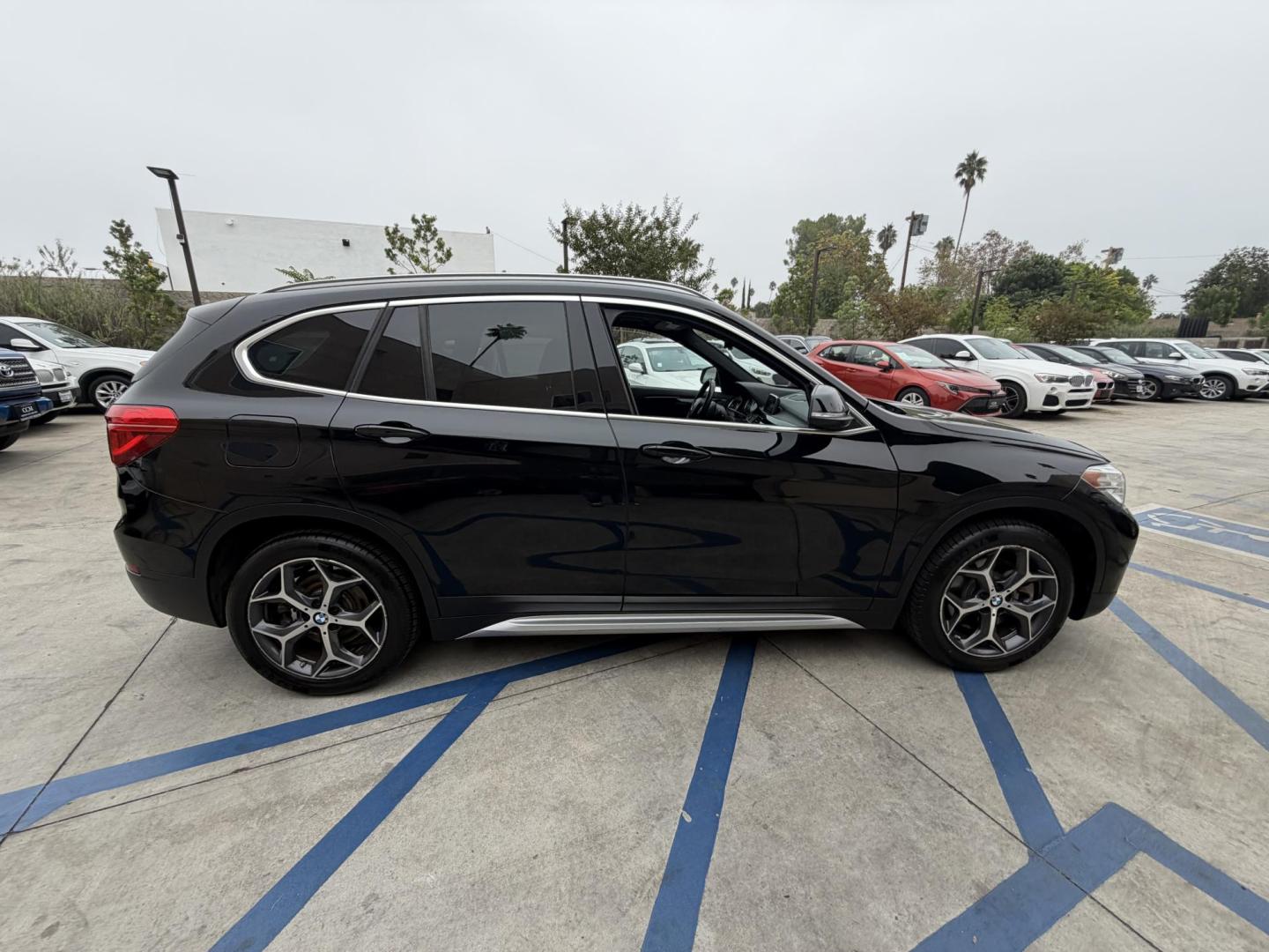 2018 Black BMW X1 xDrive28i (WBXHT3C33J5) with an 2.0L L4 DOHC 16V engine, 8A transmission, located at 30 S. Berkeley Avenue, Pasadena, CA, 91107, (626) 248-7567, 34.145447, -118.109398 - Crown City Motors is a used “Buy Here Pay Here” car dealer in Pasadena CA. “Buy Here Pay Here” financing, means that when you purchase your vehicle from our dealership, that you make the payments to the dealership as well. We do not need the banks approval to get you approved for a used auto - Photo#12