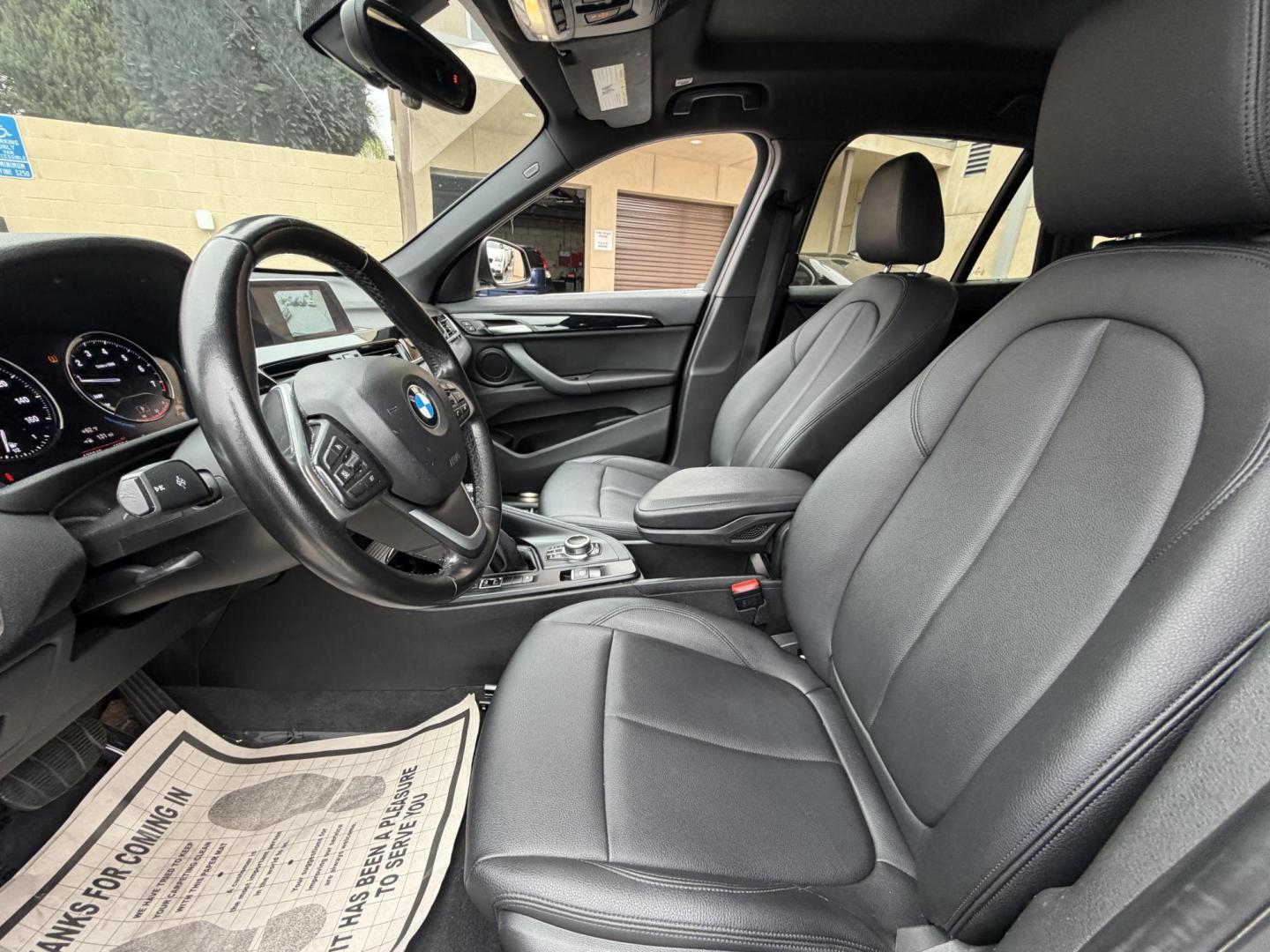 2018 Black BMW X1 xDrive28i (WBXHT3C33J5) with an 2.0L L4 DOHC 16V engine, 8A transmission, located at 30 S. Berkeley Avenue, Pasadena, CA, 91107, (626) 248-7567, 34.145447, -118.109398 - Crown City Motors is a used “Buy Here Pay Here” car dealer in Pasadena CA. “Buy Here Pay Here” financing, means that when you purchase your vehicle from our dealership, that you make the payments to the dealership as well. We do not need the banks approval to get you approved for a used auto - Photo#14