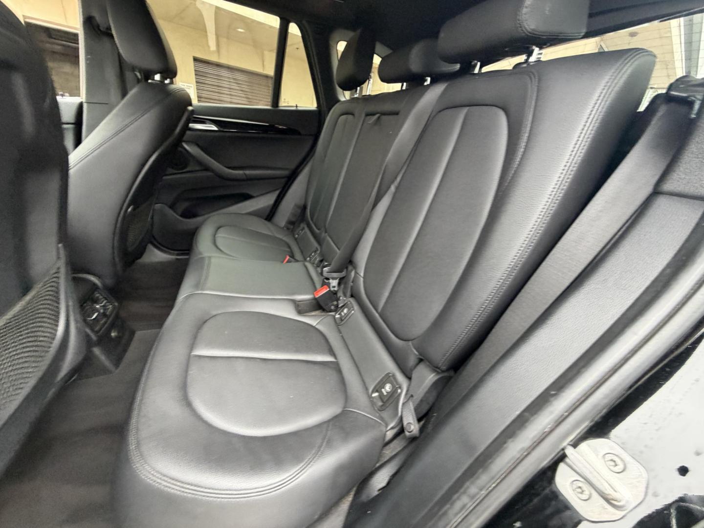 2018 Black BMW X1 xDrive28i (WBXHT3C33J5) with an 2.0L L4 DOHC 16V engine, 8A transmission, located at 30 S. Berkeley Avenue, Pasadena, CA, 91107, (626) 248-7567, 34.145447, -118.109398 - Crown City Motors is a used “Buy Here Pay Here” car dealer in Pasadena CA. “Buy Here Pay Here” financing, means that when you purchase your vehicle from our dealership, that you make the payments to the dealership as well. We do not need the banks approval to get you approved for a used auto - Photo#16