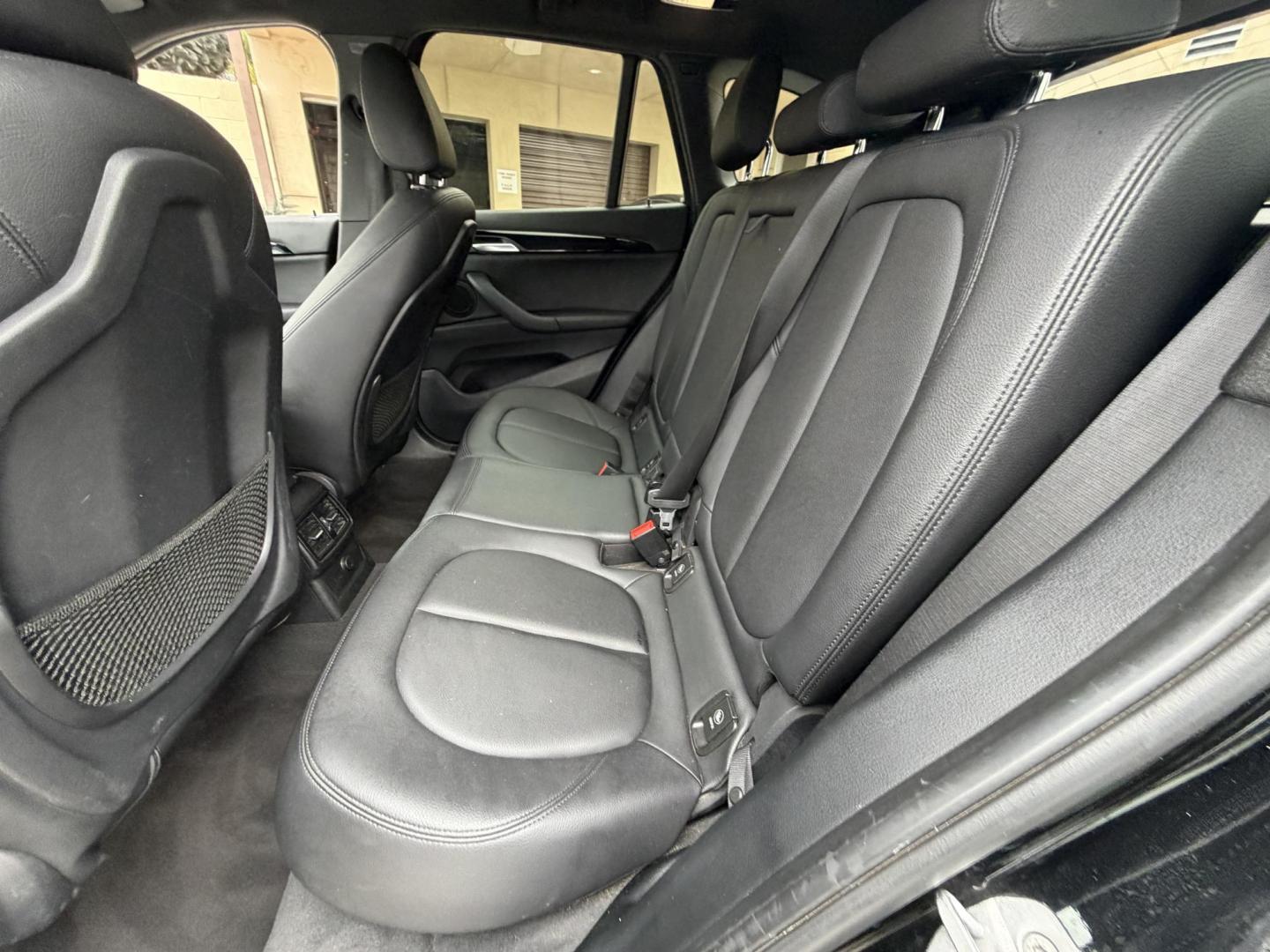 2018 Black BMW X1 xDrive28i (WBXHT3C33J5) with an 2.0L L4 DOHC 16V engine, 8A transmission, located at 30 S. Berkeley Avenue, Pasadena, CA, 91107, (626) 248-7567, 34.145447, -118.109398 - Crown City Motors is a used “Buy Here Pay Here” car dealer in Pasadena CA. “Buy Here Pay Here” financing, means that when you purchase your vehicle from our dealership, that you make the payments to the dealership as well. We do not need the banks approval to get you approved for a used auto - Photo#17