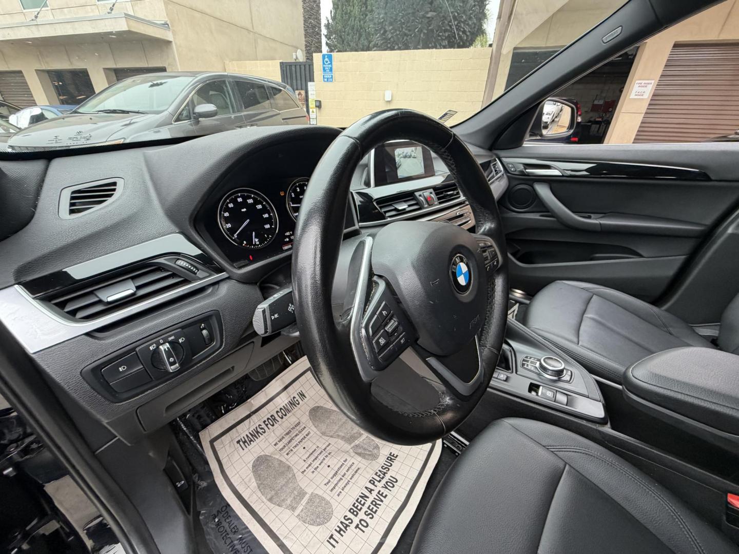 2018 Black BMW X1 xDrive28i (WBXHT3C33J5) with an 2.0L L4 DOHC 16V engine, 8A transmission, located at 30 S. Berkeley Avenue, Pasadena, CA, 91107, (626) 248-7567, 34.145447, -118.109398 - Crown City Motors is a used “Buy Here Pay Here” car dealer in Pasadena CA. “Buy Here Pay Here” financing, means that when you purchase your vehicle from our dealership, that you make the payments to the dealership as well. We do not need the banks approval to get you approved for a used auto - Photo#18