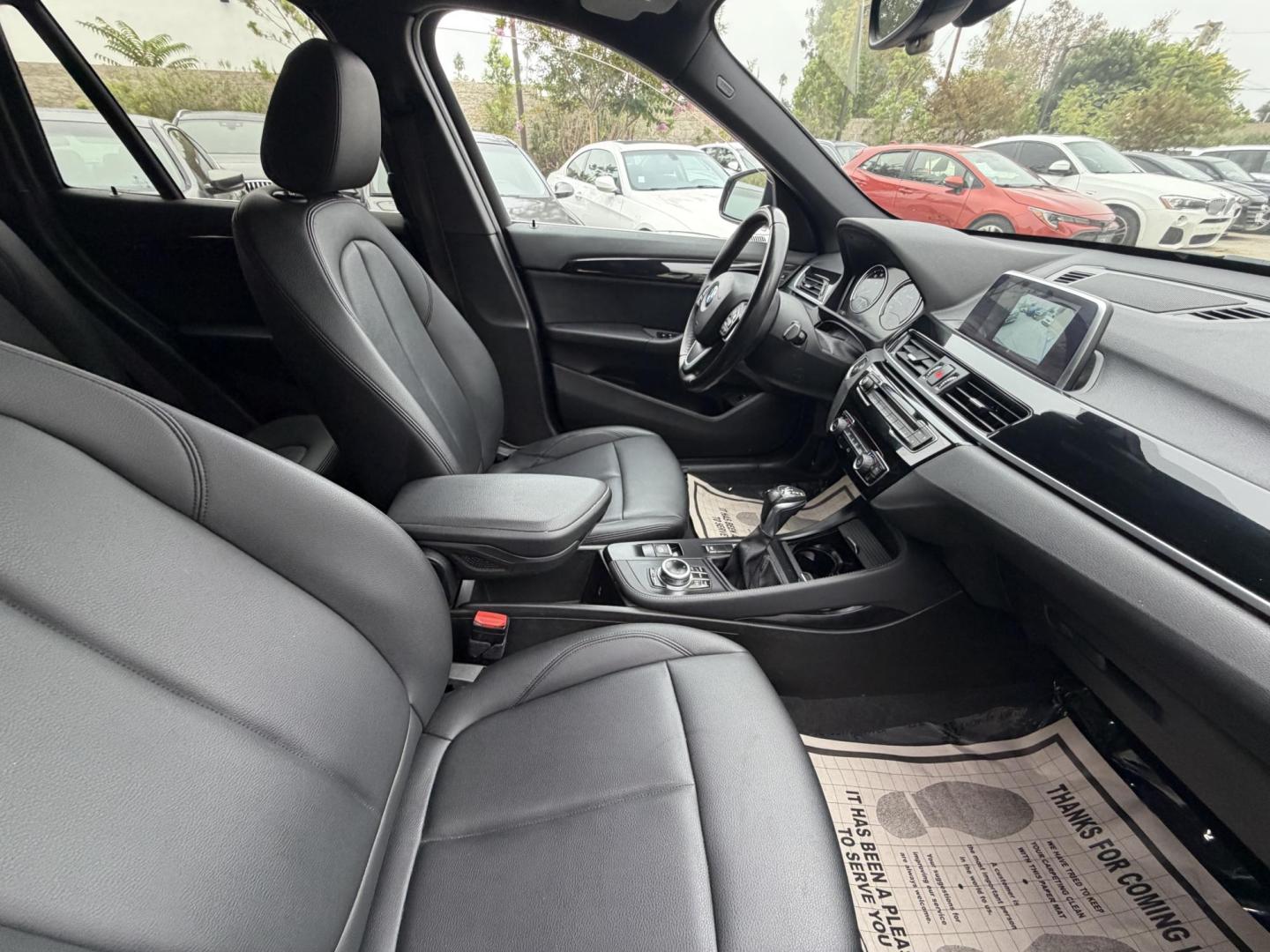 2018 Black BMW X1 xDrive28i (WBXHT3C33J5) with an 2.0L L4 DOHC 16V engine, 8A transmission, located at 30 S. Berkeley Avenue, Pasadena, CA, 91107, (626) 248-7567, 34.145447, -118.109398 - Crown City Motors is a used “Buy Here Pay Here” car dealer in Pasadena CA. “Buy Here Pay Here” financing, means that when you purchase your vehicle from our dealership, that you make the payments to the dealership as well. We do not need the banks approval to get you approved for a used auto - Photo#19