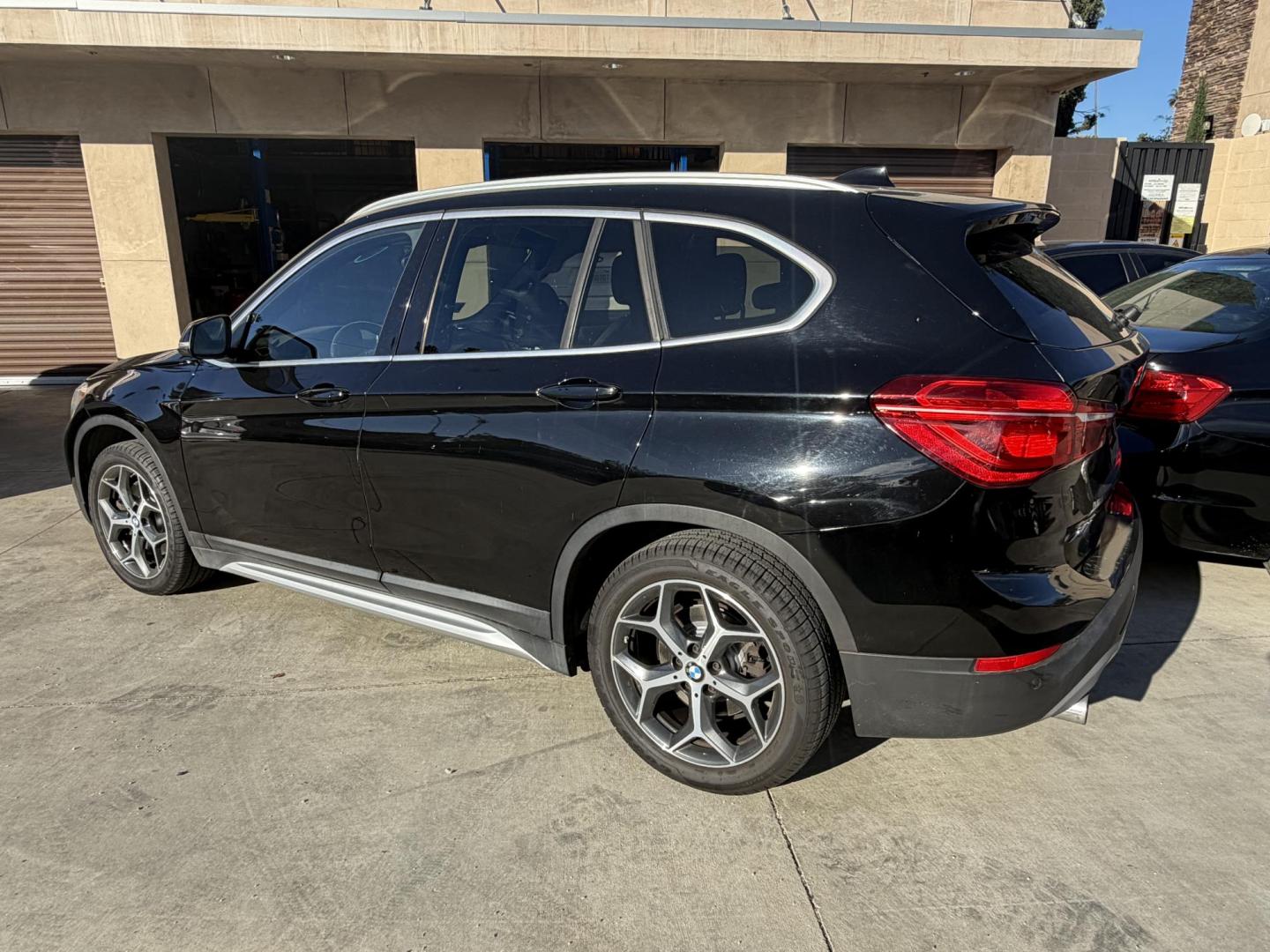 2018 Black /Black BMW X1 xDrive28i (WBXHT3C35J5) with an 2.0L L4 DOHC 16V engine, 8A transmission, located at 30 S. Berkeley Avenue, Pasadena, CA, 91107, (626) 248-7567, 34.145447, -118.109398 - BMW X1 – Black on Black – VIN: WBXHT3C35J5L28331 Luxury SUV with Buy Here Pay Here Financing – Crown City Motors, Pasadena If you’re looking for a luxury SUV with bad credit financing, this black on black BMW X3 is an excellent choice. Available now at Crown City Motors in Pasadena, th - Photo#2