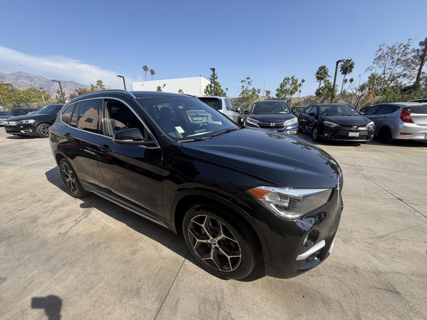 2018 Black /Black BMW X1 xDrive28i (WBXHT3C35J5) with an 2.0L L4 DOHC 16V engine, 8A transmission, located at 30 S. Berkeley Avenue, Pasadena, CA, 91107, (626) 248-7567, 34.145447, -118.109398 - BMW X1 – Black on Black – VIN: WBXHT3C35J5L28331 Luxury SUV with Buy Here Pay Here Financing – Crown City Motors, Pasadena If you’re looking for a luxury SUV with bad credit financing, this black on black BMW X3 is an excellent choice. Available now at Crown City Motors in Pasadena, th - Photo#5