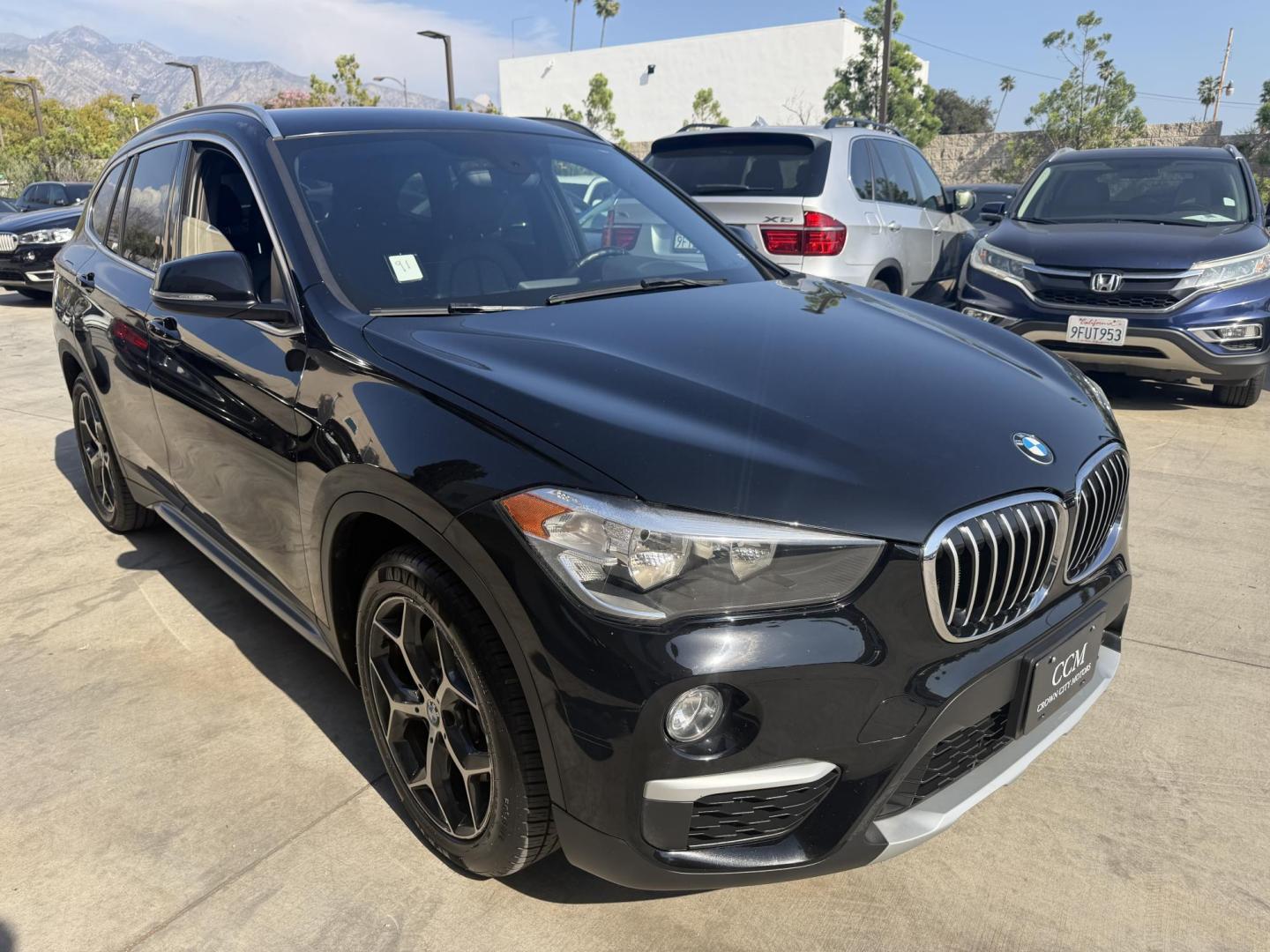 2018 Black /Black BMW X1 xDrive28i (WBXHT3C35J5) with an 2.0L L4 DOHC 16V engine, 8A transmission, located at 30 S. Berkeley Avenue, Pasadena, CA, 91107, (626) 248-7567, 34.145447, -118.109398 - BMW X1 – Black on Black – VIN: WBXHT3C35J5L28331 Luxury SUV with Buy Here Pay Here Financing – Crown City Motors, Pasadena If you’re looking for a luxury SUV with bad credit financing, this black on black BMW X3 is an excellent choice. Available now at Crown City Motors in Pasadena, th - Photo#6