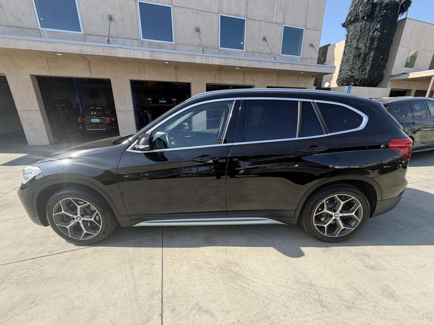 2018 Black /Black BMW X1 xDrive28i (WBXHT3C35J5) with an 2.0L L4 DOHC 16V engine, 8A transmission, located at 30 S. Berkeley Avenue, Pasadena, CA, 91107, (626) 248-7567, 34.145447, -118.109398 - BMW X1 – Black on Black – VIN: WBXHT3C35J5L28331 Luxury SUV with Buy Here Pay Here Financing – Crown City Motors, Pasadena If you’re looking for a luxury SUV with bad credit financing, this black on black BMW X3 is an excellent choice. Available now at Crown City Motors in Pasadena, th - Photo#11