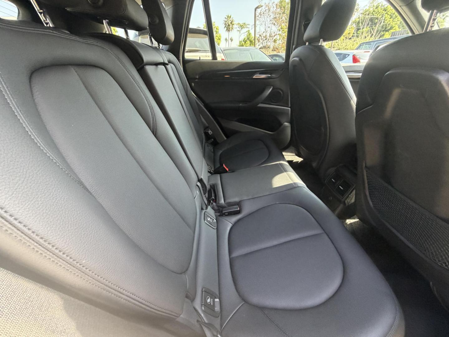 2018 Black /Black BMW X1 xDrive28i (WBXHT3C35J5) with an 2.0L L4 DOHC 16V engine, 8A transmission, located at 30 S. Berkeley Avenue, Pasadena, CA, 91107, (626) 248-7567, 34.145447, -118.109398 - BMW X1 – Black on Black – VIN: WBXHT3C35J5L28331 Luxury SUV with Buy Here Pay Here Financing – Crown City Motors, Pasadena If you’re looking for a luxury SUV with bad credit financing, this black on black BMW X3 is an excellent choice. Available now at Crown City Motors in Pasadena, th - Photo#26