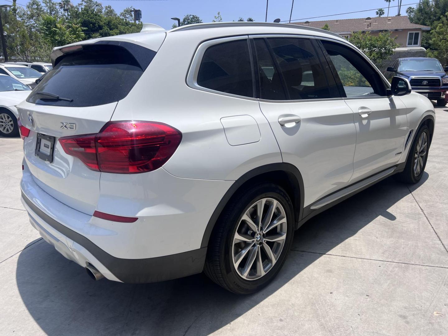 2018 Alpine White /Black BMW X3 xDrive30i (5UXTR9C56JL) with an 2.0L L4 DOHC 16V engine, 8A transmission, located at 30 S. Berkeley Avenue, Pasadena, CA, 91107, (626) 248-7567, 34.145447, -118.109398 - Photo#3