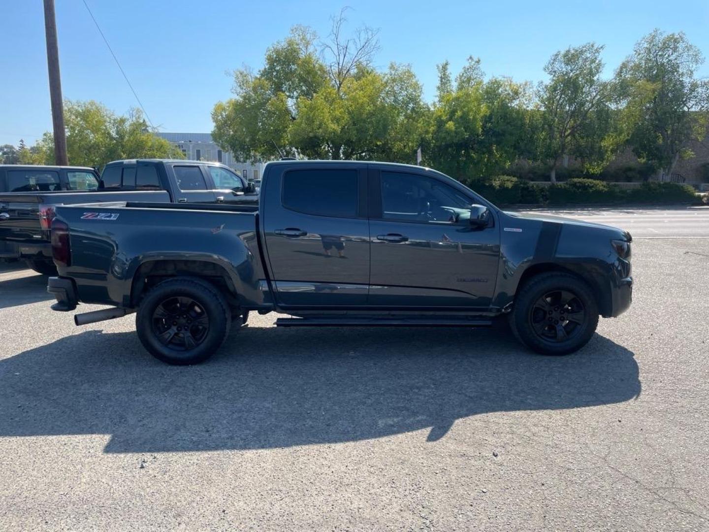 2018 Deepwood Green Metallic Chevrolet Colorado Z71 (1GCPTDE13J1) with an 0.0 Duramax 2.8L Diesel Turbo I4 181hp 369ft. lbs. Common Rail Direct Injection engine, 8-Speed Shiftable Automatic transmission, located at 800 Riverside Ave, Roseville, CA, 95678, 916-773-4549 & Toll Free: 866-719-4393, 38.732265, -121.291039 - DIESEL CREW CAB 4X4 Z-71 ONE OWNER - Photo#5