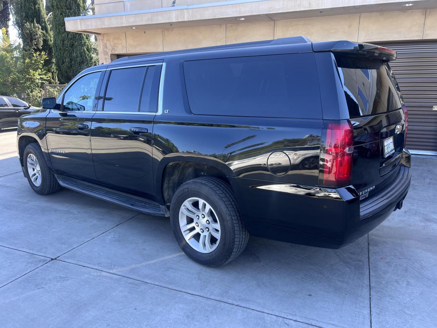 2018 BLACK /Black Chevrolet Suburban LT 2WD (1GNSCHKC6JR) with an 5.3L V8 OHV 16V engine, 6A transmission, located at 30 S. Berkeley Avenue, Pasadena, CA, 91107, (626) 248-7567, 34.145447, -118.109398 - Looking for a reliable, spacious, and powerful full-size SUV? Check out this stunning 2018 Chevrolet Suburban, available now at Crown City Motors, located at 30 S Berkeley Ave, Pasadena, CA 91107. With the VIN 1GNSCHKC6JR267945, this pre-owned Suburban is the perfect blend of luxury, performance, an - Photo#2