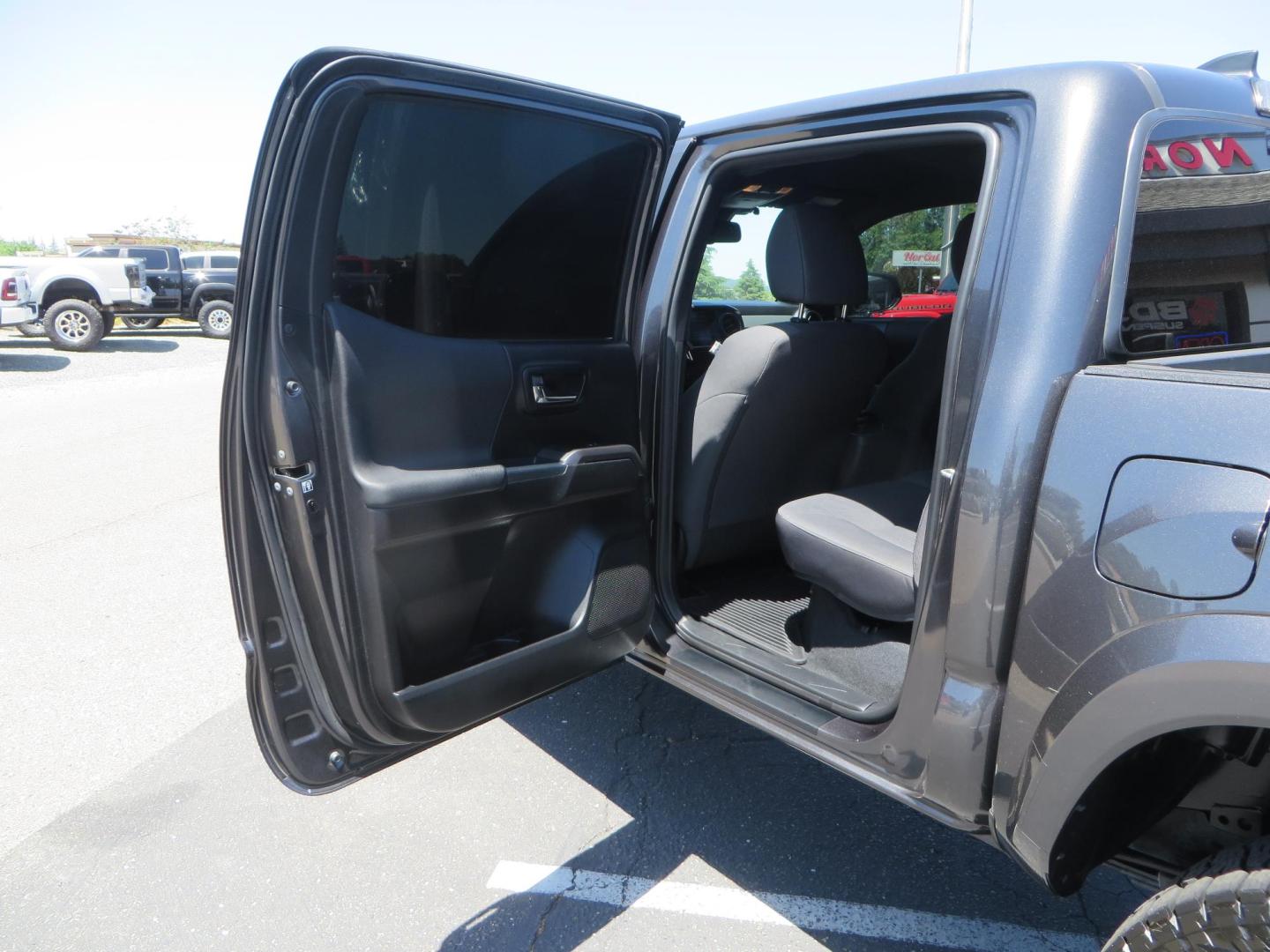 2018 CHARCOAL Toyota Tacoma TRD Sport Double Cab V6 6AT 4WD (3TMCZ5AN1JM) with an 3.6L V6 DOHC 24V engine, 6A transmission, located at 2630 Grass Valley Highway, Auburn, CA, 95603, (530) 508-5100, 38.937893, -121.095482 - Features a level kit, Nitto Terra Grappler G3 tires, TRD exhaust, and window tint. - Photo#33