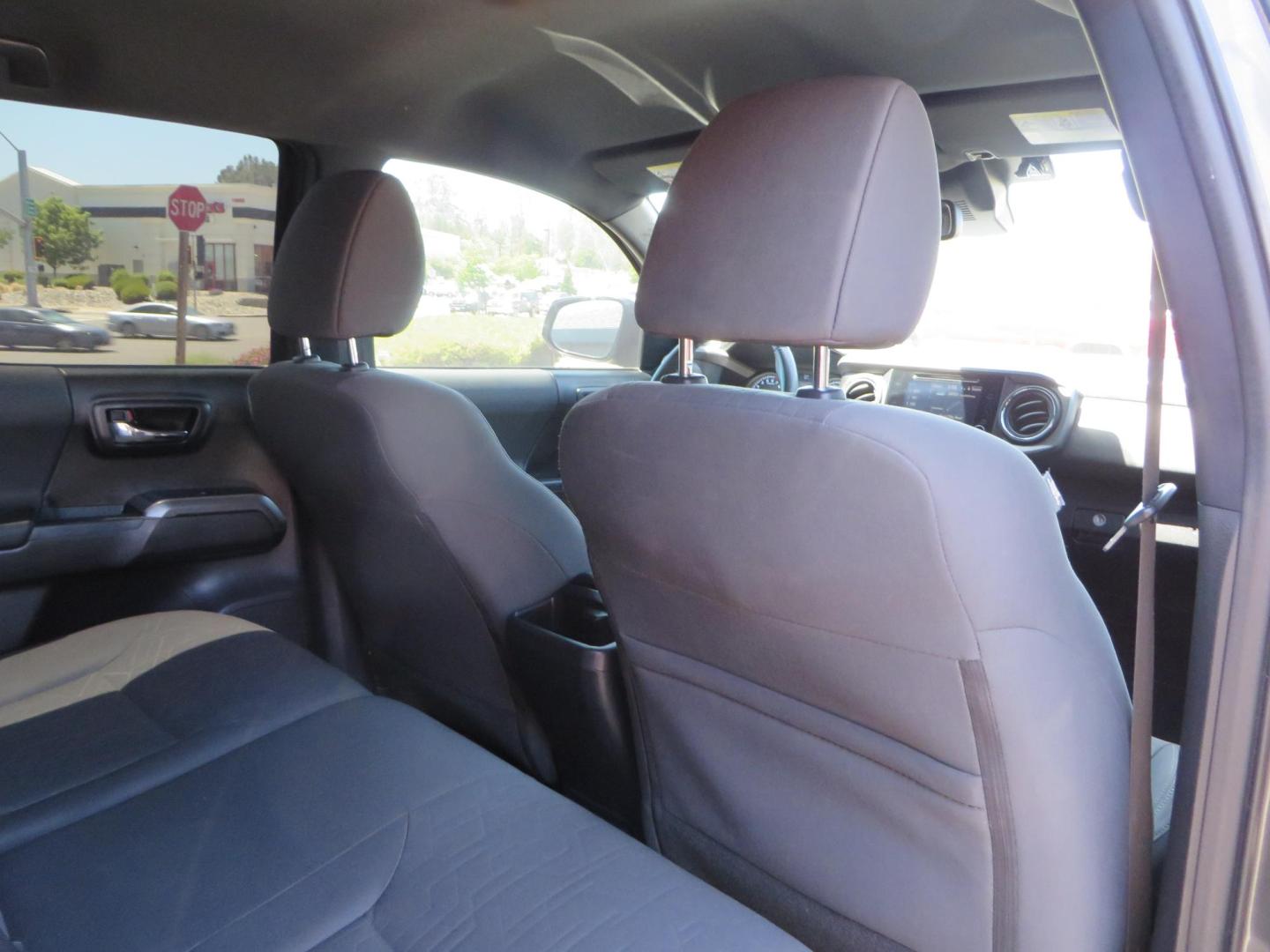 2018 CHARCOAL Toyota Tacoma TRD Sport Double Cab V6 6AT 4WD (3TMCZ5AN1JM) with an 3.6L V6 DOHC 24V engine, 6A transmission, located at 2630 Grass Valley Highway, Auburn, CA, 95603, (530) 508-5100, 38.937893, -121.095482 - Features a level kit, Nitto Terra Grappler G3 tires, TRD exhaust, and window tint. - Photo#53
