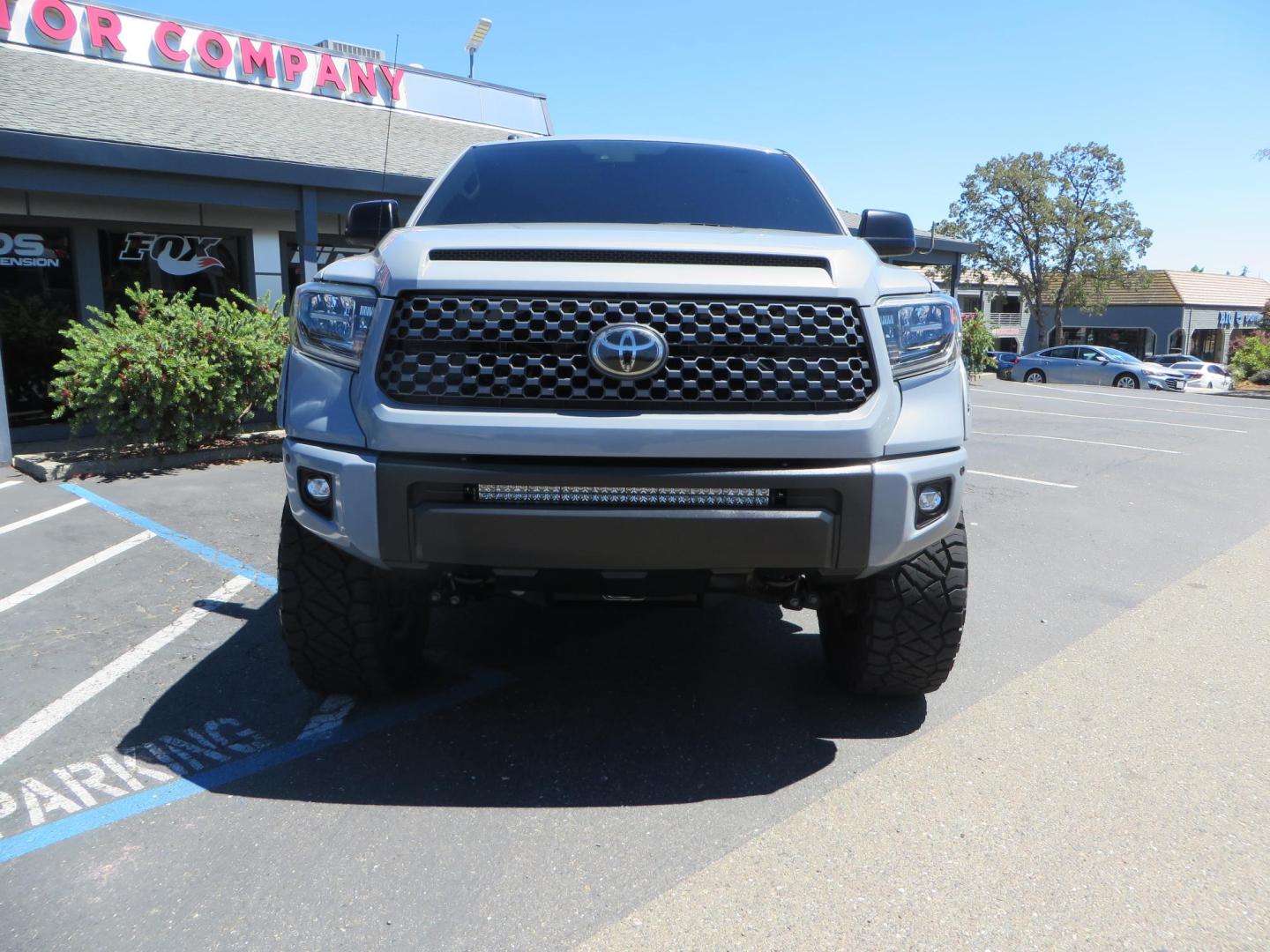 2018 Gray /Black Toyota Tundra SR5 5.7L V8 CrewMax 4WD (5TFDY5F15JX) with an 5.7L V8 DOHC 32V engine, 6A transmission, located at 2630 Grass Valley Highway, Auburn, CA, 95603, (530) 508-5100, 38.937893, -121.095482 - Lifted Tundra sitting on a Pro Comp 6" Lift kit, 37" Nitto Ridge Grappler tires, 20" Fuel Recoil wheels, N-Fab running boards, Grille Mounted Light Bar, Bilstein 5100 rear shocks, TRD dual exhaust, Fender Flares, and window tint. - Photo#7