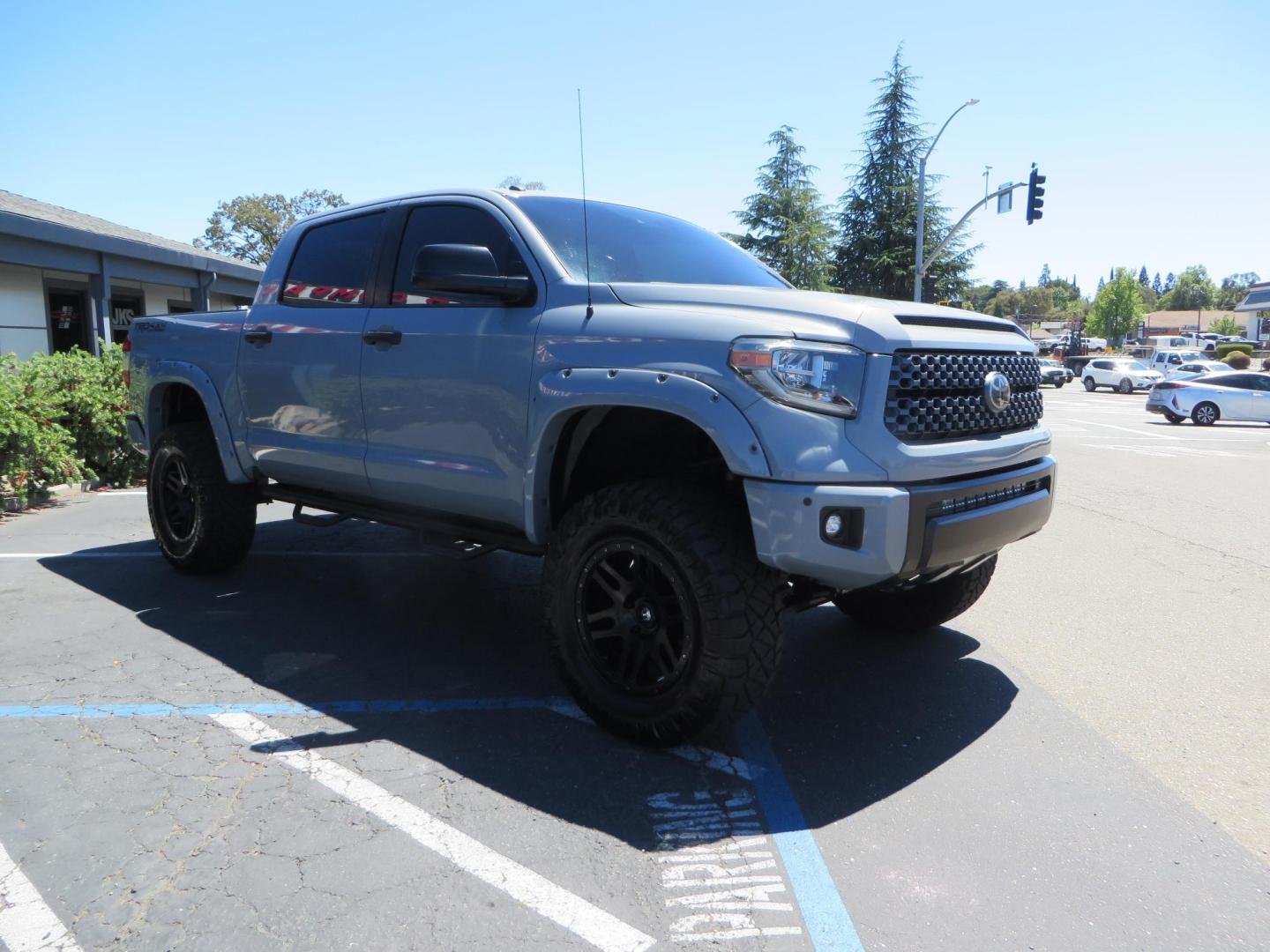 2018 Gray /Black Toyota Tundra SR5 5.7L V8 CrewMax 4WD (5TFDY5F15JX) with an 5.7L V8 DOHC 32V engine, 6A transmission, located at 2630 Grass Valley Highway, Auburn, CA, 95603, (530) 508-5100, 38.937893, -121.095482 - Lifted Tundra sitting on a Pro Comp 6" Lift kit, 37" Nitto Ridge Grappler tires, 20" Fuel Recoil wheels, N-Fab running boards, Grille Mounted Light Bar, Bilstein 5100 rear shocks, TRD dual exhaust, Fender Flares, and window tint. - Photo#6