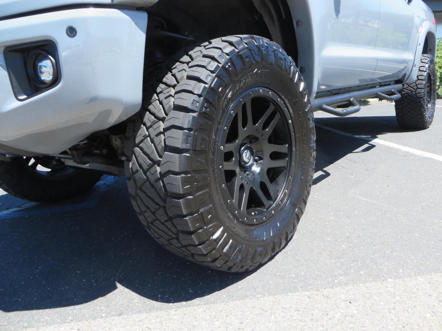 2018 Gray /Black Toyota Tundra SR5 5.7L V8 CrewMax 4WD (5TFDY5F15JX) with an 5.7L V8 DOHC 32V engine, 6A transmission, located at 2630 Grass Valley Highway, Auburn, CA, 95603, (530) 508-5100, 38.937893, -121.095482 - Lifted Tundra sitting on a Pro Comp 6" Lift kit, 37" Nitto Ridge Grappler tires, 20" Fuel Recoil wheels, N-Fab running boards, Grille Mounted Light Bar, Bilstein 5100 rear shocks, TRD dual exhaust, Fender Flares, and window tint. - Photo#9