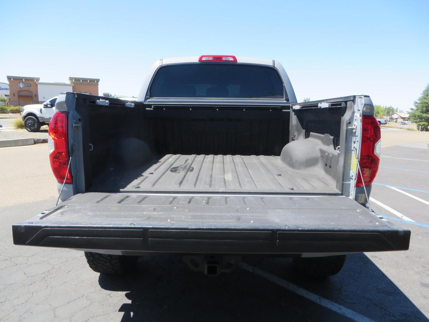 2018 Gray /Black Toyota Tundra SR5 5.7L V8 CrewMax 4WD (5TFDY5F15JX) with an 5.7L V8 DOHC 32V engine, 6A transmission, located at 2630 Grass Valley Highway, Auburn, CA, 95603, (530) 508-5100, 38.937893, -121.095482 - Lifted Tundra sitting on a Pro Comp 6" Lift kit, 37" Nitto Ridge Grappler tires, 20" Fuel Recoil wheels, N-Fab running boards, Grille Mounted Light Bar, Bilstein 5100 rear shocks, TRD dual exhaust, Fender Flares, and window tint. - Photo#14