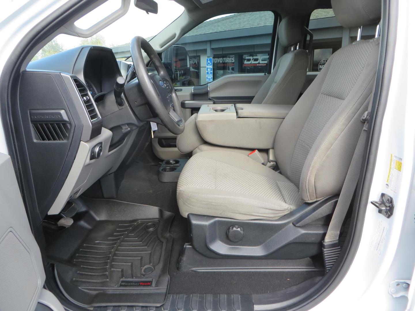 2019 White Ford F-250 SD XLT Crew Cab Short Bed 4WD (1FT7W2BT9KE) with an 6.7L V8 OHV 16V DIESEL engine, 6A transmission, located at 2630 Grass Valley Highway, Auburn, CA, 95603, (530) 508-5100, 38.937893, -121.095482 - Leveled XLT sitting on 22" SOTA Novakane wheels, 325 Nitto Ridge Grappler tires, Fox Shocks and dual steering stabilizers, Firestone Ride Rite air bags, Airlift wireless 1 air compressor, B and W Turnover gooseneck hitch, Weathertech floor liners, Deezee tailgate assist, and window tint. - Photo#22