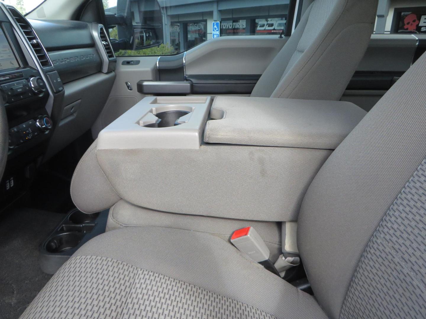 2019 White Ford F-250 SD XLT Crew Cab Short Bed 4WD (1FT7W2BT9KE) with an 6.7L V8 OHV 16V DIESEL engine, 6A transmission, located at 2630 Grass Valley Highway, Auburn, CA, 95603, (530) 508-5100, 38.937893, -121.095482 - Leveled XLT sitting on 22" SOTA Novakane wheels, 325 Nitto Ridge Grappler tires, Fox Shocks and dual steering stabilizers, Firestone Ride Rite air bags, Airlift wireless 1 air compressor, B and W Turnover gooseneck hitch, Weathertech floor liners, Deezee tailgate assist, and window tint. - Photo#25