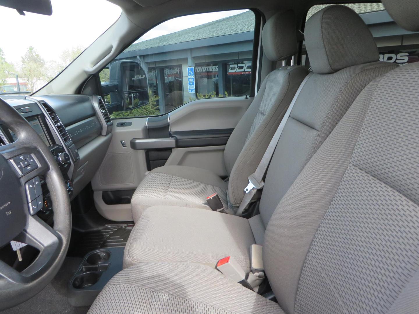 2019 White Ford F-250 SD XLT Crew Cab Short Bed 4WD (1FT7W2BT9KE) with an 6.7L V8 OHV 16V DIESEL engine, 6A transmission, located at 2630 Grass Valley Highway, Auburn, CA, 95603, (530) 508-5100, 38.937893, -121.095482 - Leveled XLT sitting on 22" SOTA Novakane wheels, 325 Nitto Ridge Grappler tires, Fox Shocks and dual steering stabilizers, Firestone Ride Rite air bags, Airlift wireless 1 air compressor, B and W Turnover gooseneck hitch, Weathertech floor liners, Deezee tailgate assist, and window tint. - Photo#26