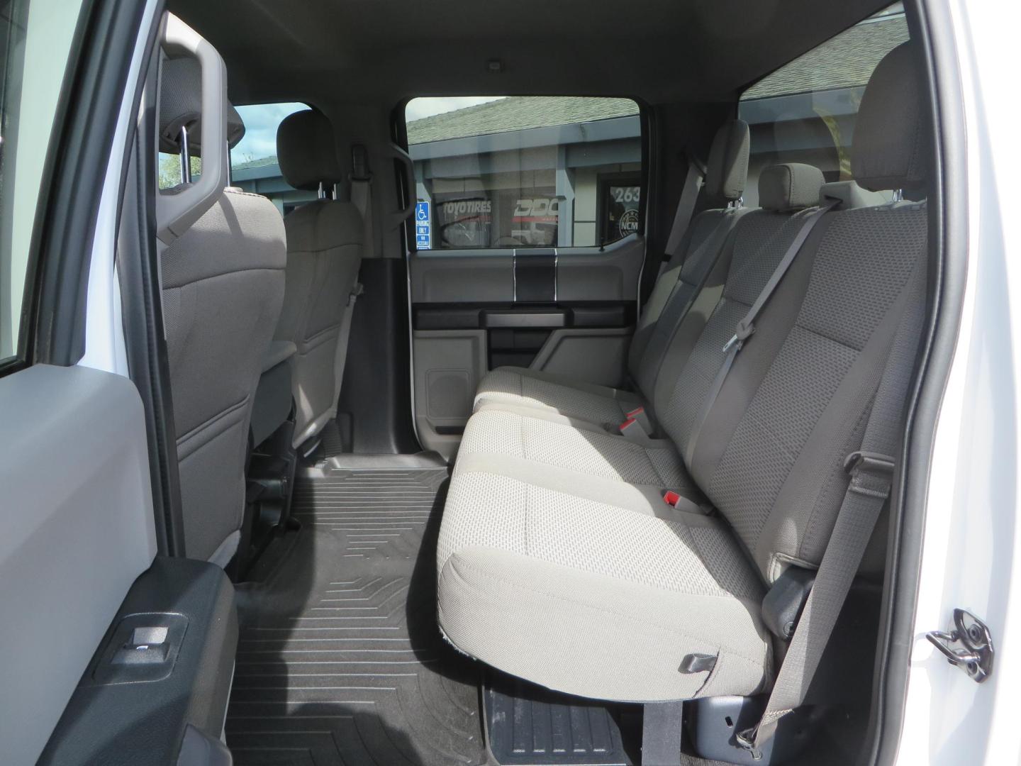 2019 White Ford F-250 SD XLT Crew Cab Short Bed 4WD (1FT7W2BT9KE) with an 6.7L V8 OHV 16V DIESEL engine, 6A transmission, located at 2630 Grass Valley Highway, Auburn, CA, 95603, (530) 508-5100, 38.937893, -121.095482 - Leveled XLT sitting on 22" SOTA Novakane wheels, 325 Nitto Ridge Grappler tires, Fox Shocks and dual steering stabilizers, Firestone Ride Rite air bags, Airlift wireless 1 air compressor, B and W Turnover gooseneck hitch, Weathertech floor liners, Deezee tailgate assist, and window tint. - Photo#44