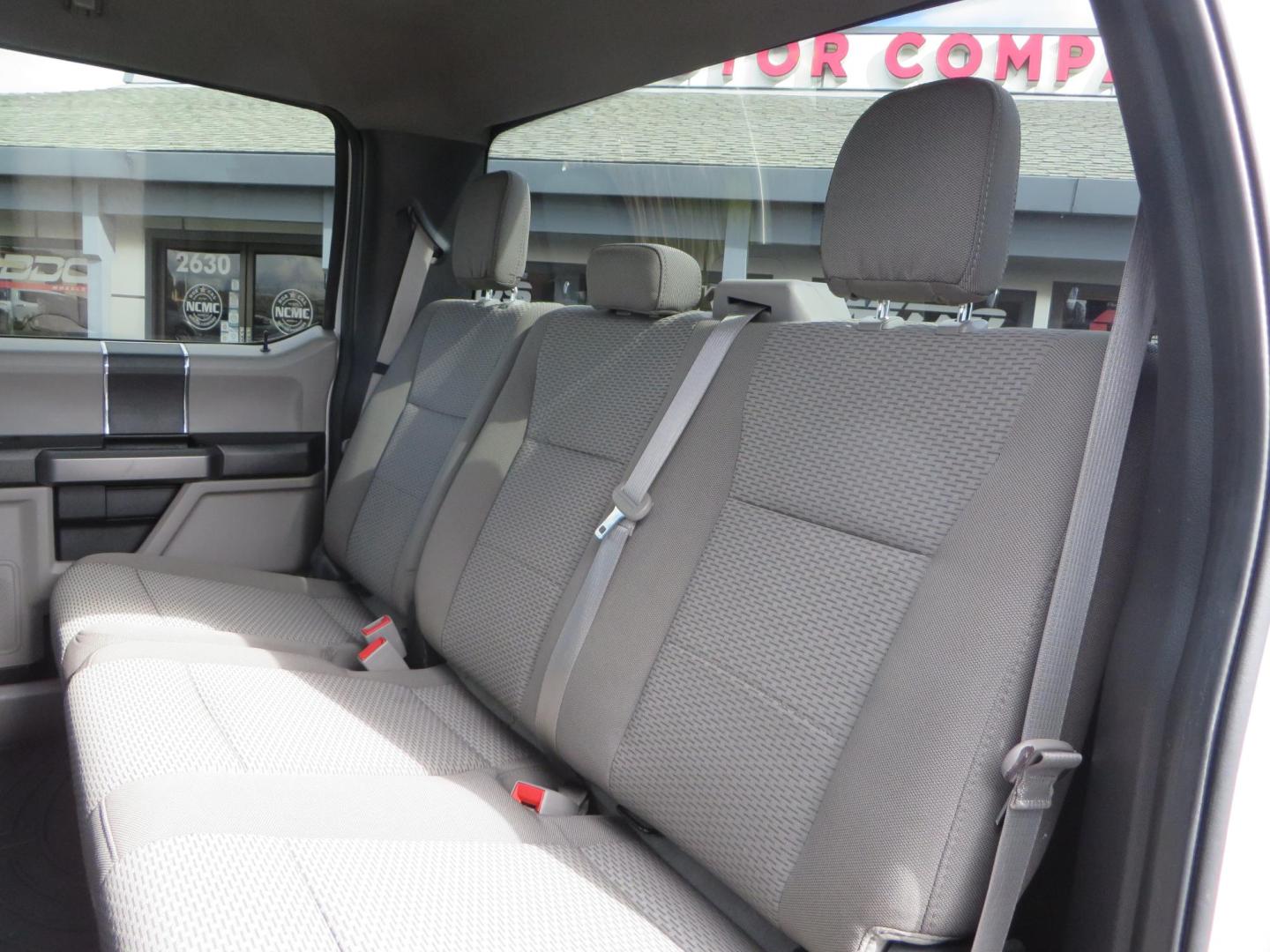 2019 White Ford F-250 SD XLT Crew Cab Short Bed 4WD (1FT7W2BT9KE) with an 6.7L V8 OHV 16V DIESEL engine, 6A transmission, located at 2630 Grass Valley Highway, Auburn, CA, 95603, (530) 508-5100, 38.937893, -121.095482 - Leveled XLT sitting on 22" SOTA Novakane wheels, 325 Nitto Ridge Grappler tires, Fox Shocks and dual steering stabilizers, Firestone Ride Rite air bags, Airlift wireless 1 air compressor, B and W Turnover gooseneck hitch, Weathertech floor liners, Deezee tailgate assist, and window tint. - Photo#45