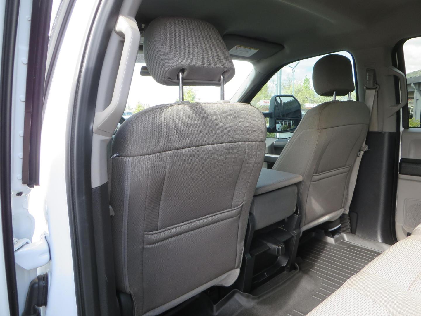 2019 White Ford F-250 SD XLT Crew Cab Short Bed 4WD (1FT7W2BT9KE) with an 6.7L V8 OHV 16V DIESEL engine, 6A transmission, located at 2630 Grass Valley Highway, Auburn, CA, 95603, (530) 508-5100, 38.937893, -121.095482 - Leveled XLT sitting on 22" SOTA Novakane wheels, 325 Nitto Ridge Grappler tires, Fox Shocks and dual steering stabilizers, Firestone Ride Rite air bags, Airlift wireless 1 air compressor, B and W Turnover gooseneck hitch, Weathertech floor liners, Deezee tailgate assist, and window tint. - Photo#47