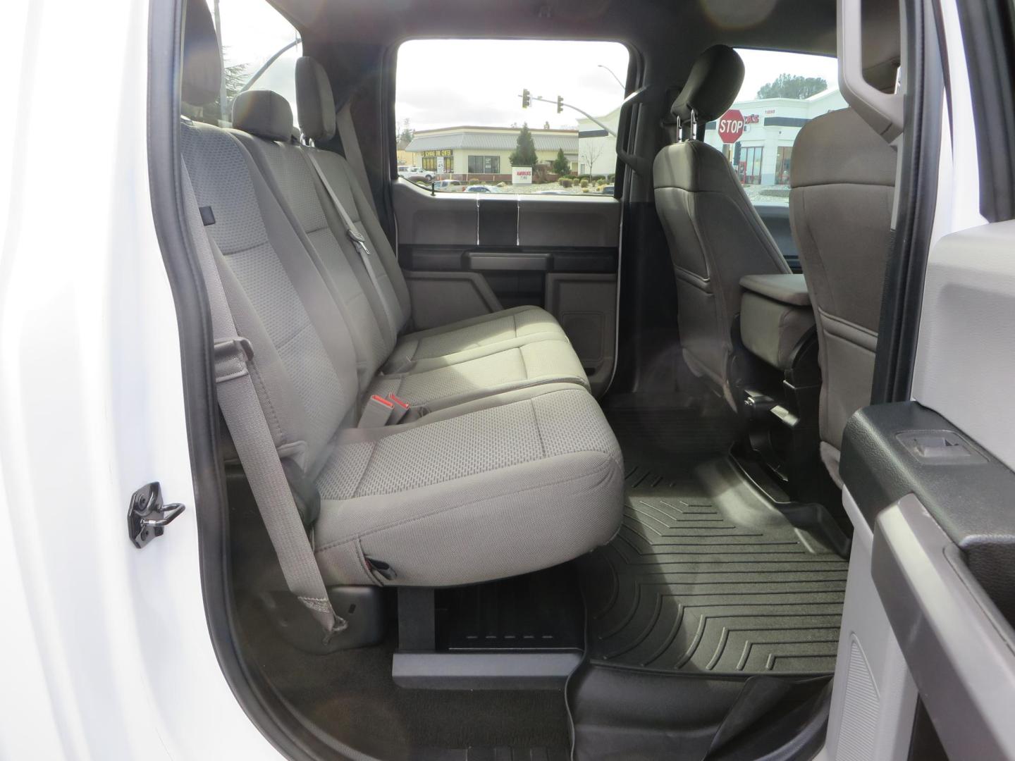 2019 White Ford F-250 SD XLT Crew Cab Short Bed 4WD (1FT7W2BT9KE) with an 6.7L V8 OHV 16V DIESEL engine, 6A transmission, located at 2630 Grass Valley Highway, Auburn, CA, 95603, (530) 508-5100, 38.937893, -121.095482 - Leveled XLT sitting on 22" SOTA Novakane wheels, 325 Nitto Ridge Grappler tires, Fox Shocks and dual steering stabilizers, Firestone Ride Rite air bags, Airlift wireless 1 air compressor, B and W Turnover gooseneck hitch, Weathertech floor liners, Deezee tailgate assist, and window tint. - Photo#58