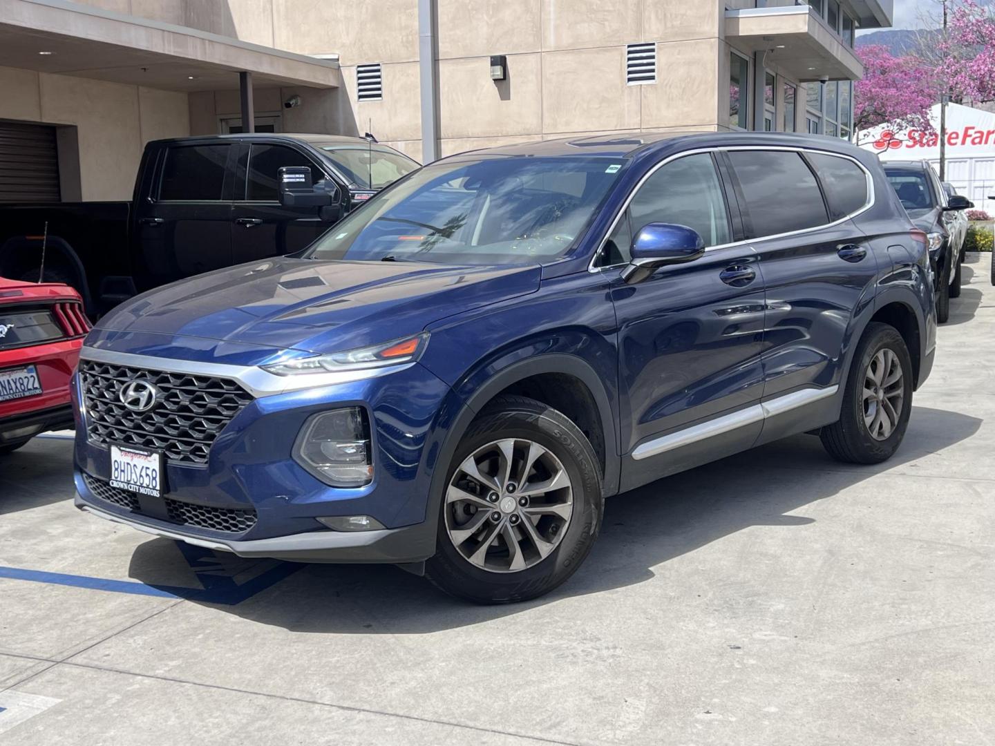 2019 Stormy BLue /Black Hyundai Santa Fe SEL 2.4 (5NMS33AD0KH) with an 2.4L L4 DOHC 16V engine, 8A transmission, located at 30 S. Berkeley Avenue, Pasadena, CA, 91107, (626) 248-7567, 34.145447, -118.109398 - Are you in the market for a stylish, reliable, and family-friendly SUV? Look no further than this 2019 Hyundai Santa Fe, available now at Crown City Motors, located at 30 S Berkeley Ave, Pasadena, CA 91107. As a premier Buy Here Pay Here dealership in Pasadena, we’re proud to offer this exceptiona - Photo#0