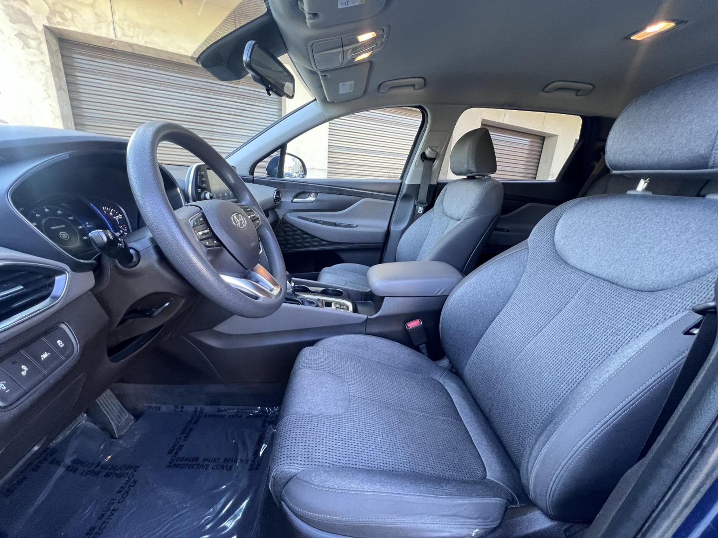 2019 Stormy BLue /Black Hyundai Santa Fe SEL 2.4 (5NMS33AD0KH) with an 2.4L L4 DOHC 16V engine, 8A transmission, located at 30 S. Berkeley Avenue, Pasadena, CA, 91107, (626) 248-7567, 34.145447, -118.109398 - Are you in the market for a stylish, reliable, and family-friendly SUV? Look no further than this 2019 Hyundai Santa Fe, available now at Crown City Motors, located at 30 S Berkeley Ave, Pasadena, CA 91107. As a premier Buy Here Pay Here dealership in Pasadena, we’re proud to offer this exceptiona - Photo#22