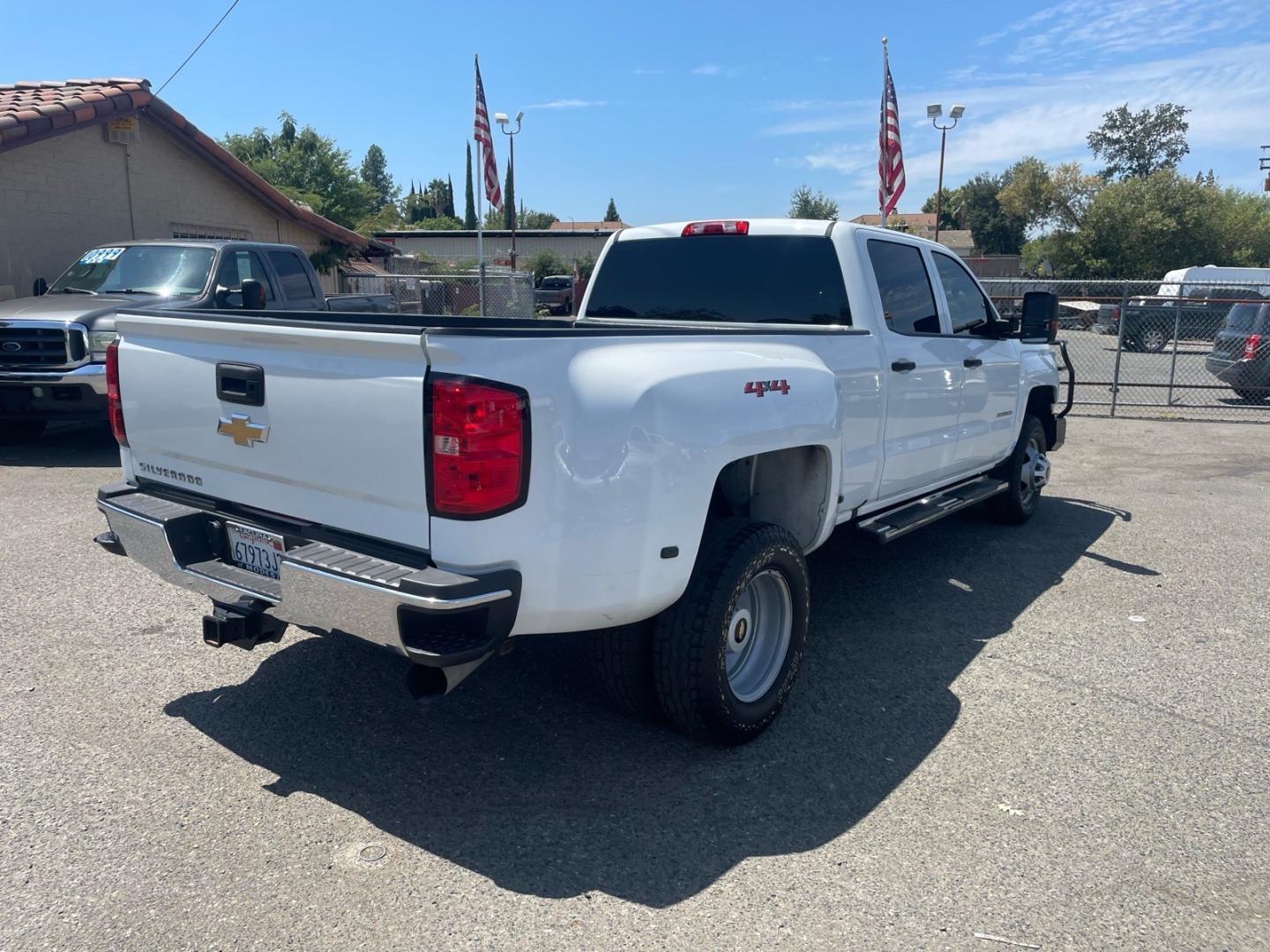 2019 Summit White Chevrolet Silverado 3500HD Work Truck (1GC4KVCY0KF) with an 6.6L Duramax 6.6L Biodiesel Turbo V8 445hp 910ft. lbs. Common Rail Direct Injection engine, Allison 1000 6-Speed Shiftable Automatic transmission, located at 800 Riverside Ave, Roseville, CA, 95678, 916-773-4549 & Toll Free: 866-719-4393, 38.732265, -121.291039 - DURAMAX DIESEL CREW CAB DUALLY 4X4 DIESEL ALLISON TRANSMISSION SERVICE RECORDS ON CLEAN CARFAX- Photo#4