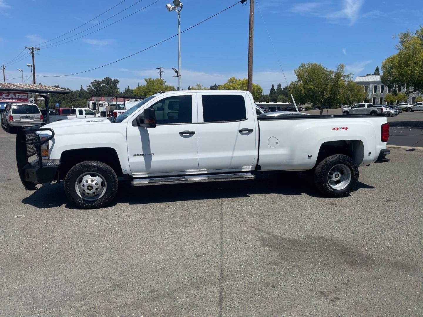 2019 Summit White Chevrolet Silverado 3500HD Work Truck (1GC4KVCY0KF) with an 6.6L Duramax 6.6L Biodiesel Turbo V8 445hp 910ft. lbs. Common Rail Direct Injection engine, Allison 1000 6-Speed Shiftable Automatic transmission, located at 800 Riverside Ave, Roseville, CA, 95678, 916-773-4549 & Toll Free: 866-719-4393, 38.732265, -121.291039 - DURAMAX DIESEL CREW CAB DUALLY 4X4 DIESEL ALLISON TRANSMISSION SERVICE RECORDS ON CLEAN CARFAX- Photo#5