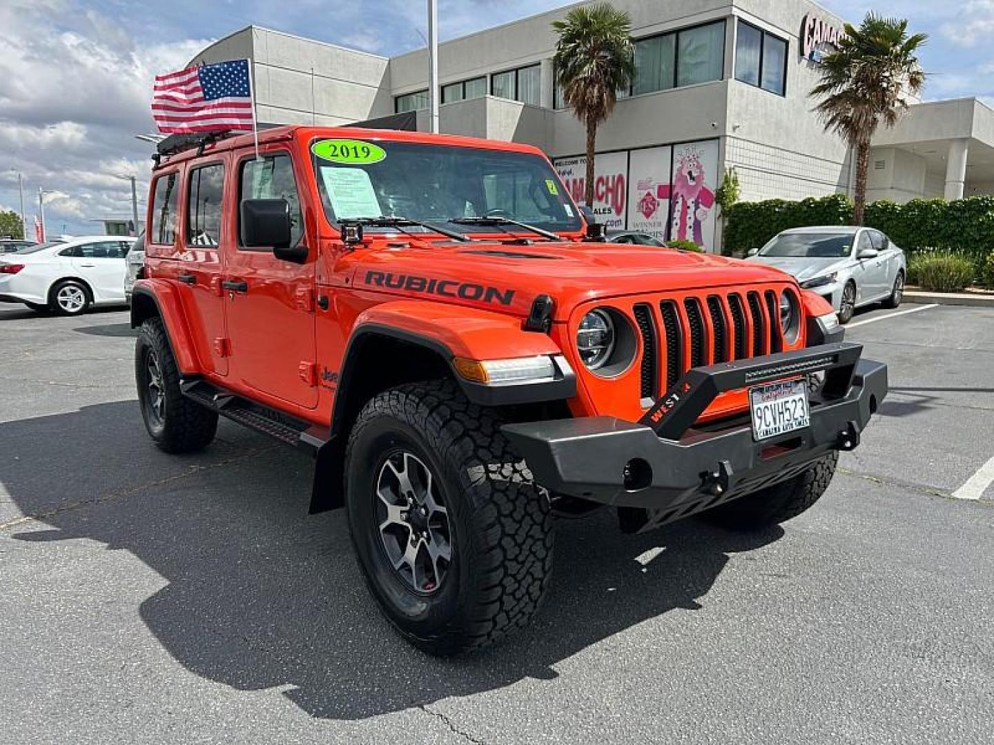 2019 ORANGE Jeep Wrangler Unlimited (1C4HJXFG1KW) with an 6-Cyl 3.6 Liter engine, Automatic transmission, located at 412 Auto Vista Drive, Palmdale, 93551, (661) 945-0620, 34.592636, -118.136681 - Photo#0